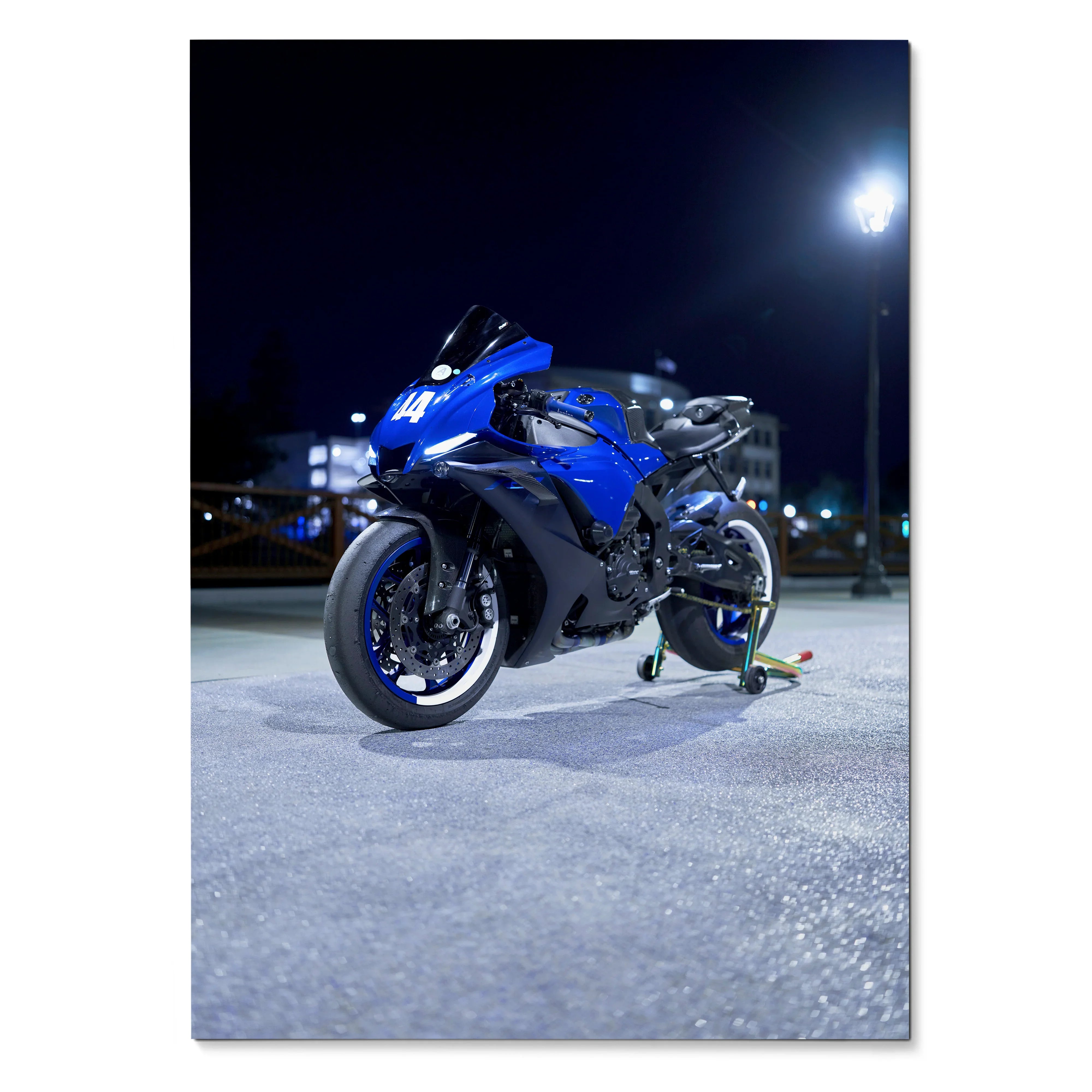 Blue Yamaha R1 motorcycle poster displayed at night with streetlight glow and sharp detail wall art.