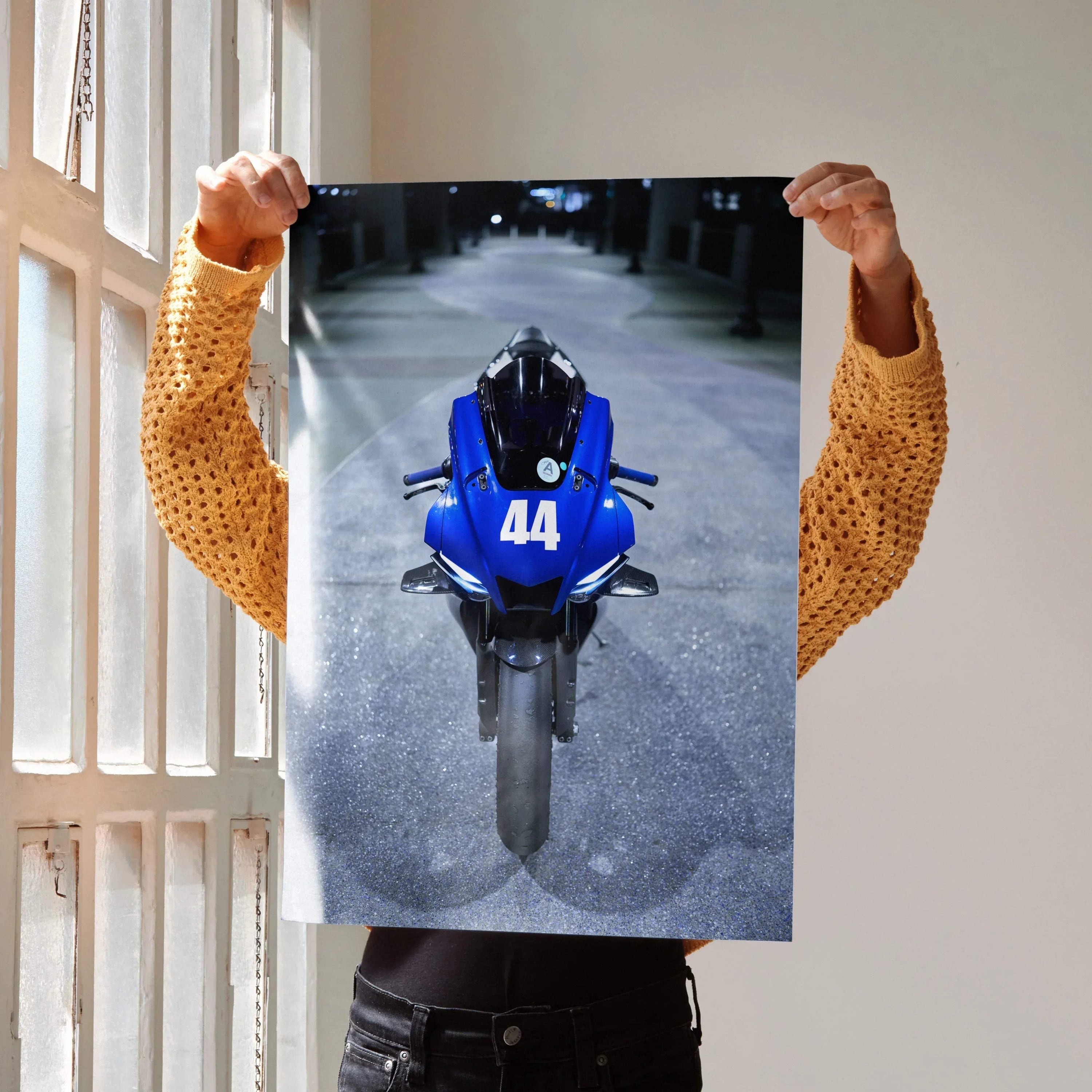 Blue Yamaha YZF-R1 motorcycle front view poster wall art with number 44 on a street background.