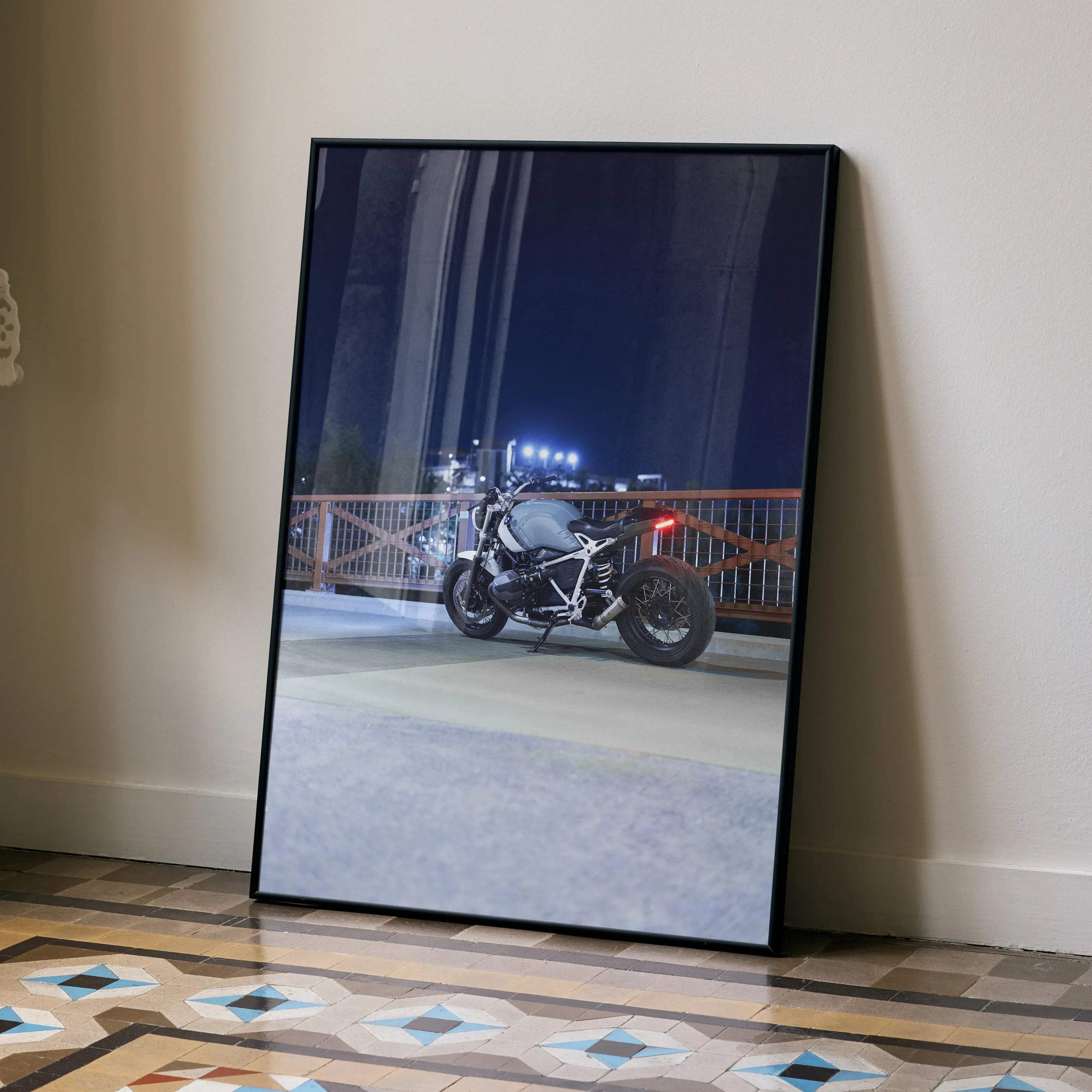 BMW R Nine T motorcycle night ride poster wall art with urban cityscape background.