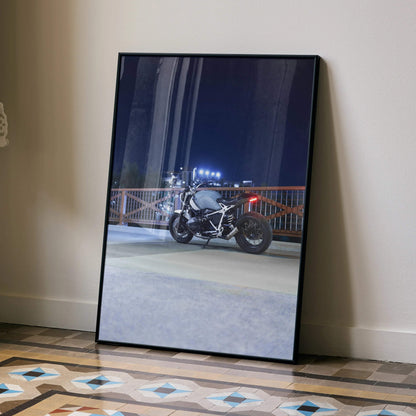 BMW R Nine T motorcycle night ride poster wall art with urban cityscape background.