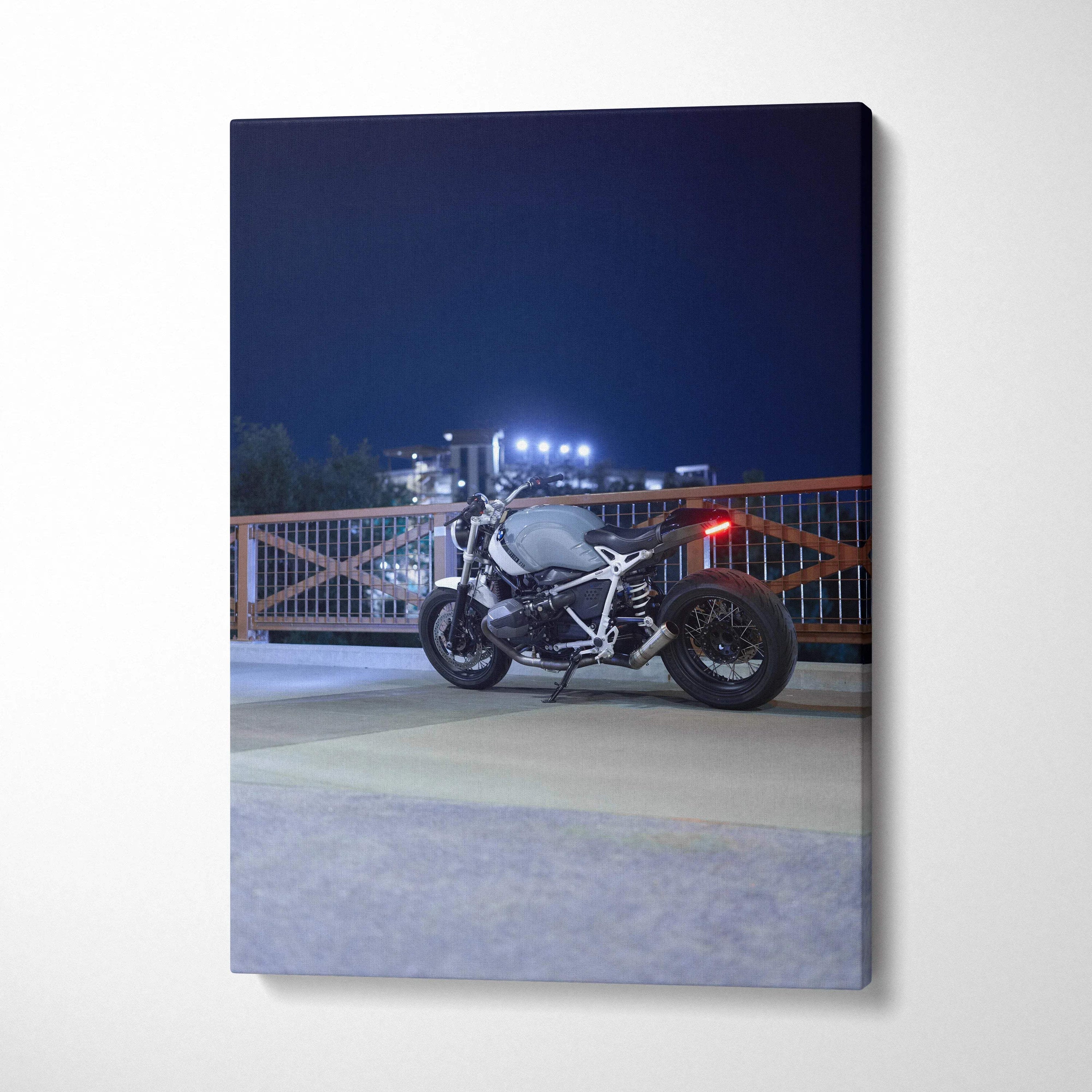 BMW R Nine T motorcycle lit at night on canvas wall art print in vertical format.