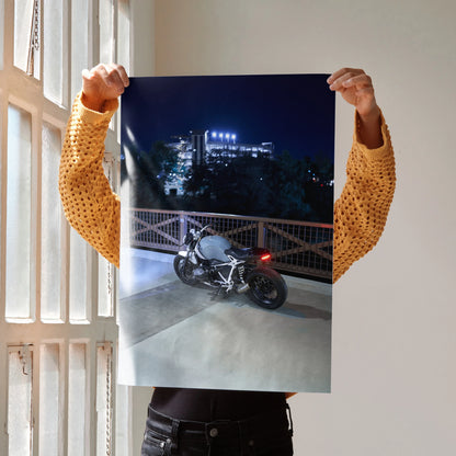Poster of BMW R Nine T motorcycle at night on urban rooftop, modern wall art with moody lighting.