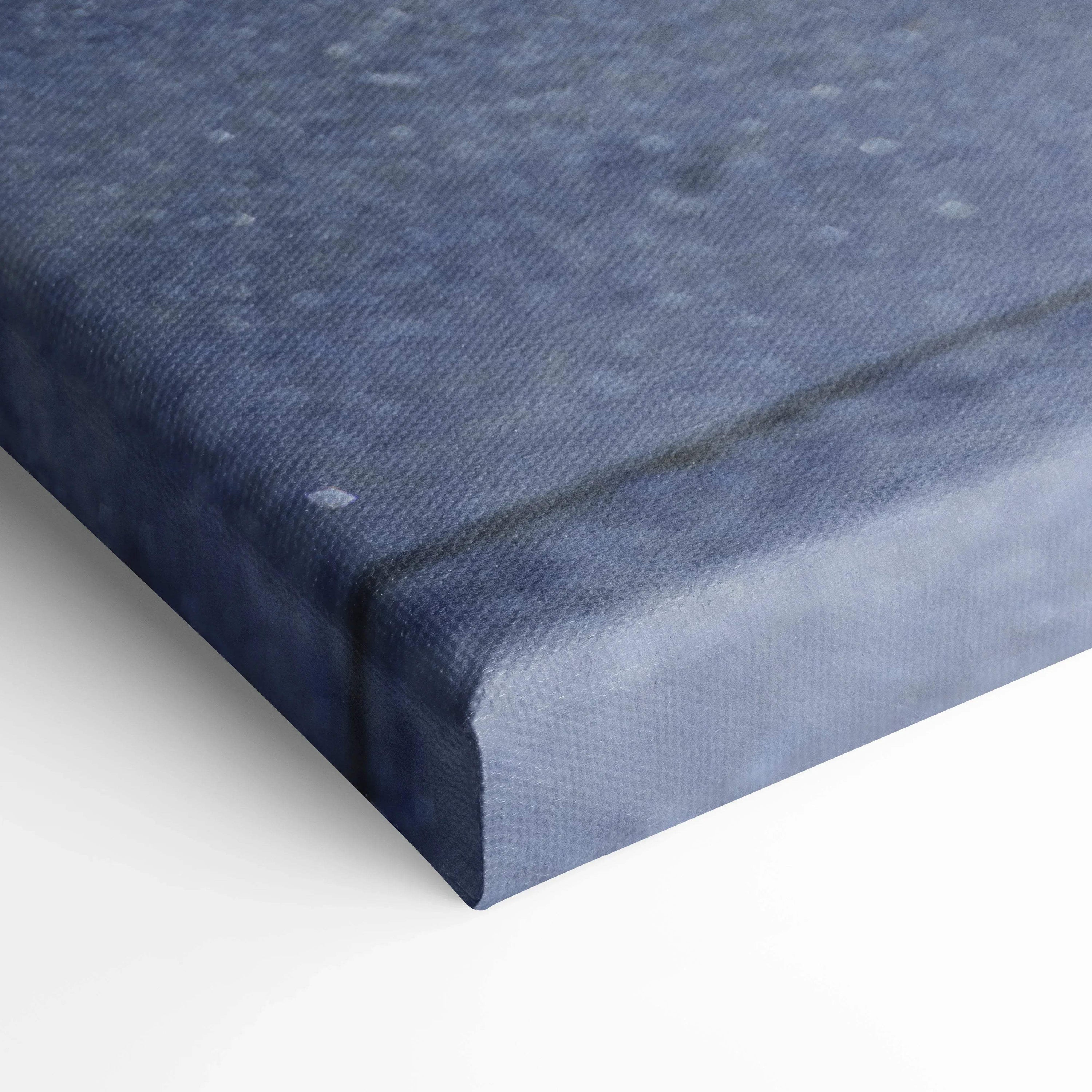 Close-up of blue textured canvas wall art corner with visible fabric weave and clean edge wrap.