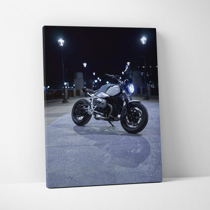 BMW R Nine T motorcycle wall art canvas print with night city lighting, vertical format.