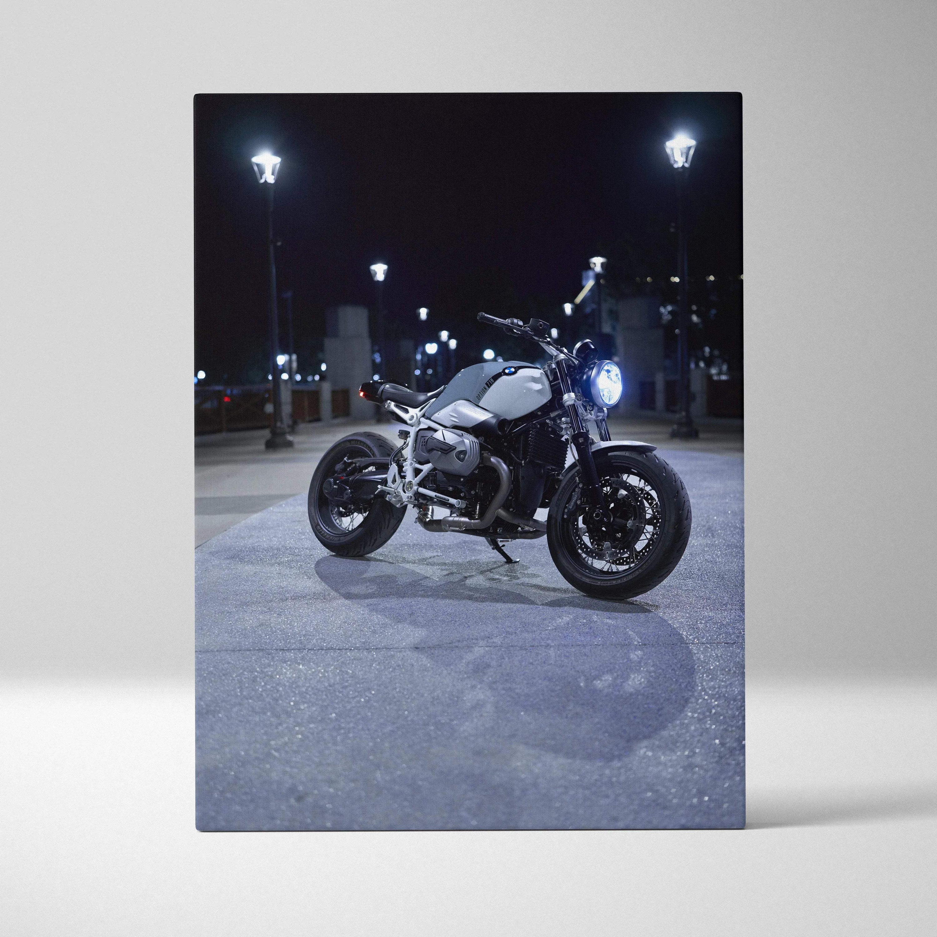 BMW R Nine T motorcycle nighttime scene canvas wall art with urban lighting and shadows.