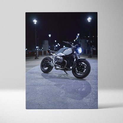 BMW R Nine T motorcycle nighttime scene canvas wall art with urban lighting and shadows.