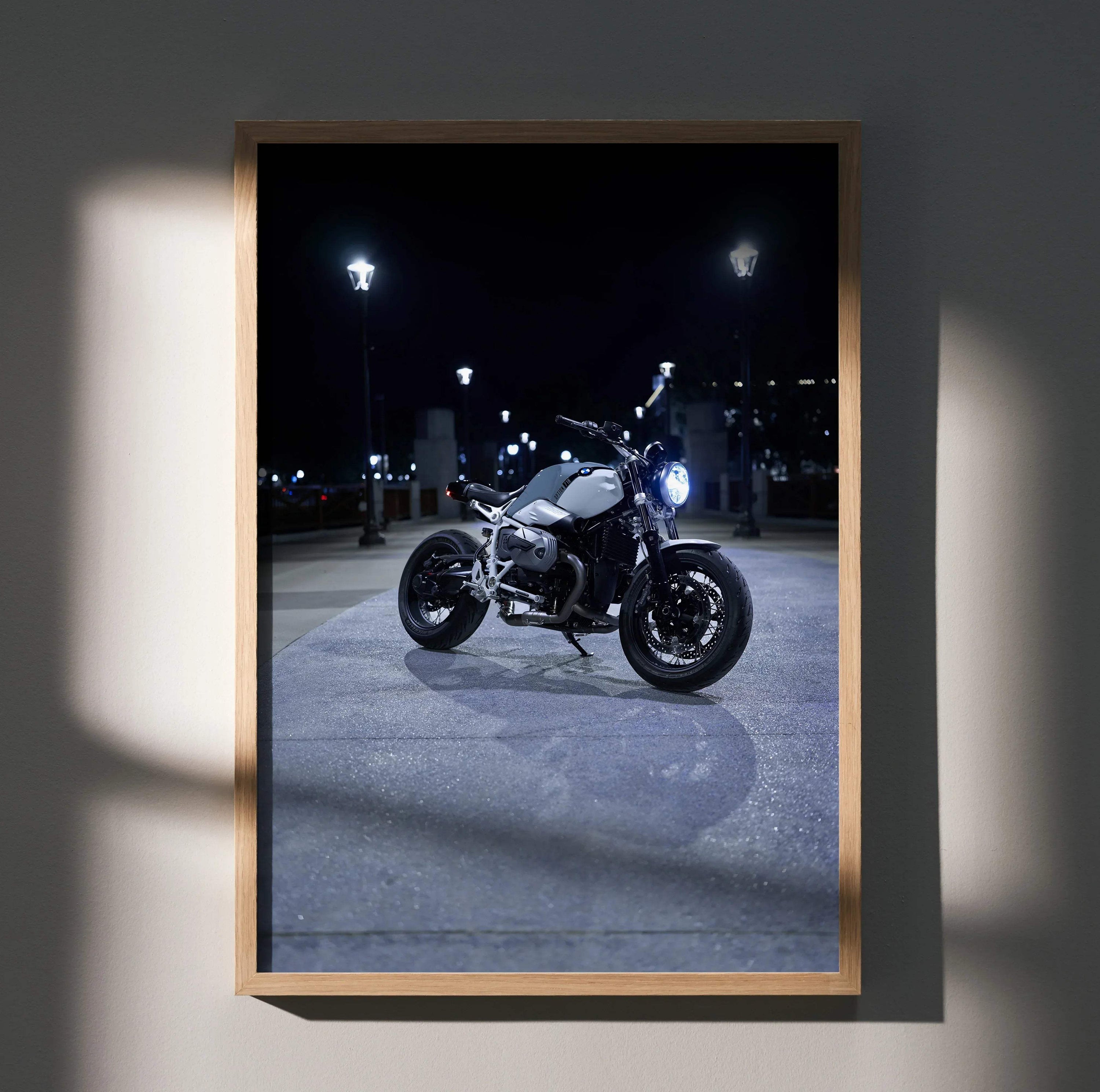 BMW R Nine T motorcycle illuminated at night poster wall art in wooden frame.