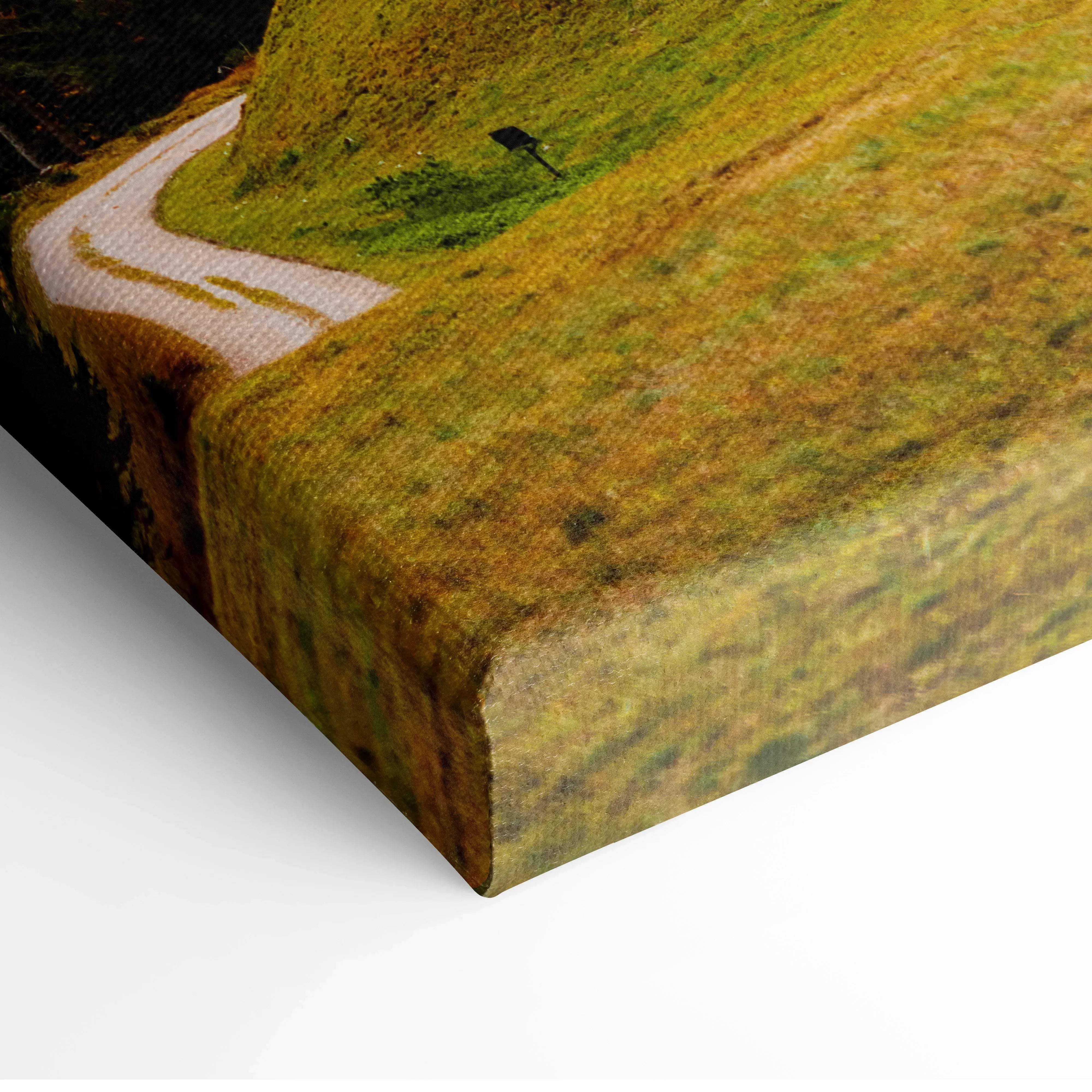 Autumn alpine village canvas wall art featuring a winding white path through golden green rolling hills and forested mountains