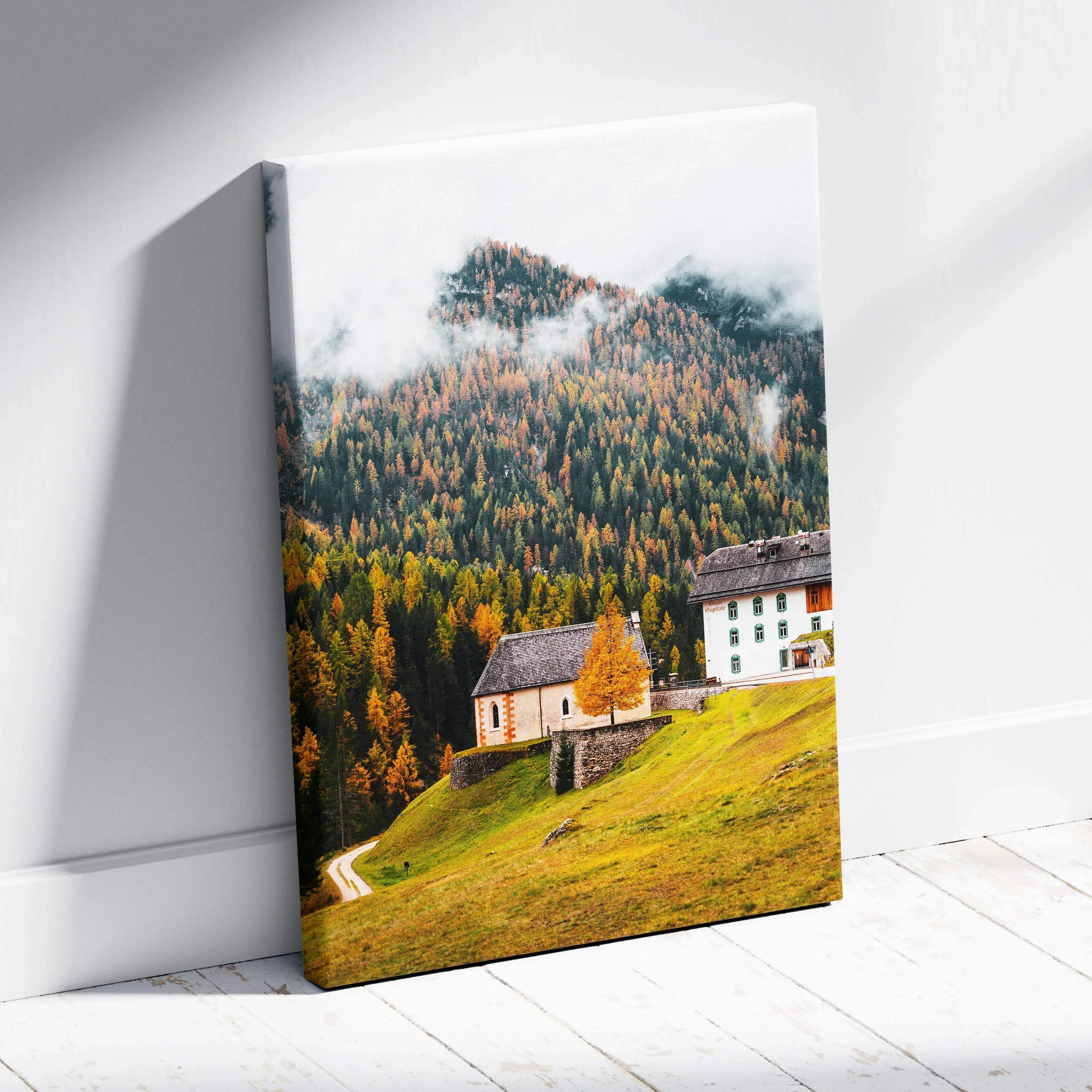 Rectangular canvas wall art depicting a misty autumn alpine village with forested mountains and rustic buildings