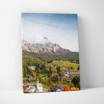 Canvas wall art print featuring a colorful mountain landscape with village and clear blue sky.