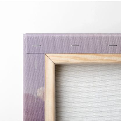 Close-up of wooden frame and purple stretched canvas corner for vertical wall art print.