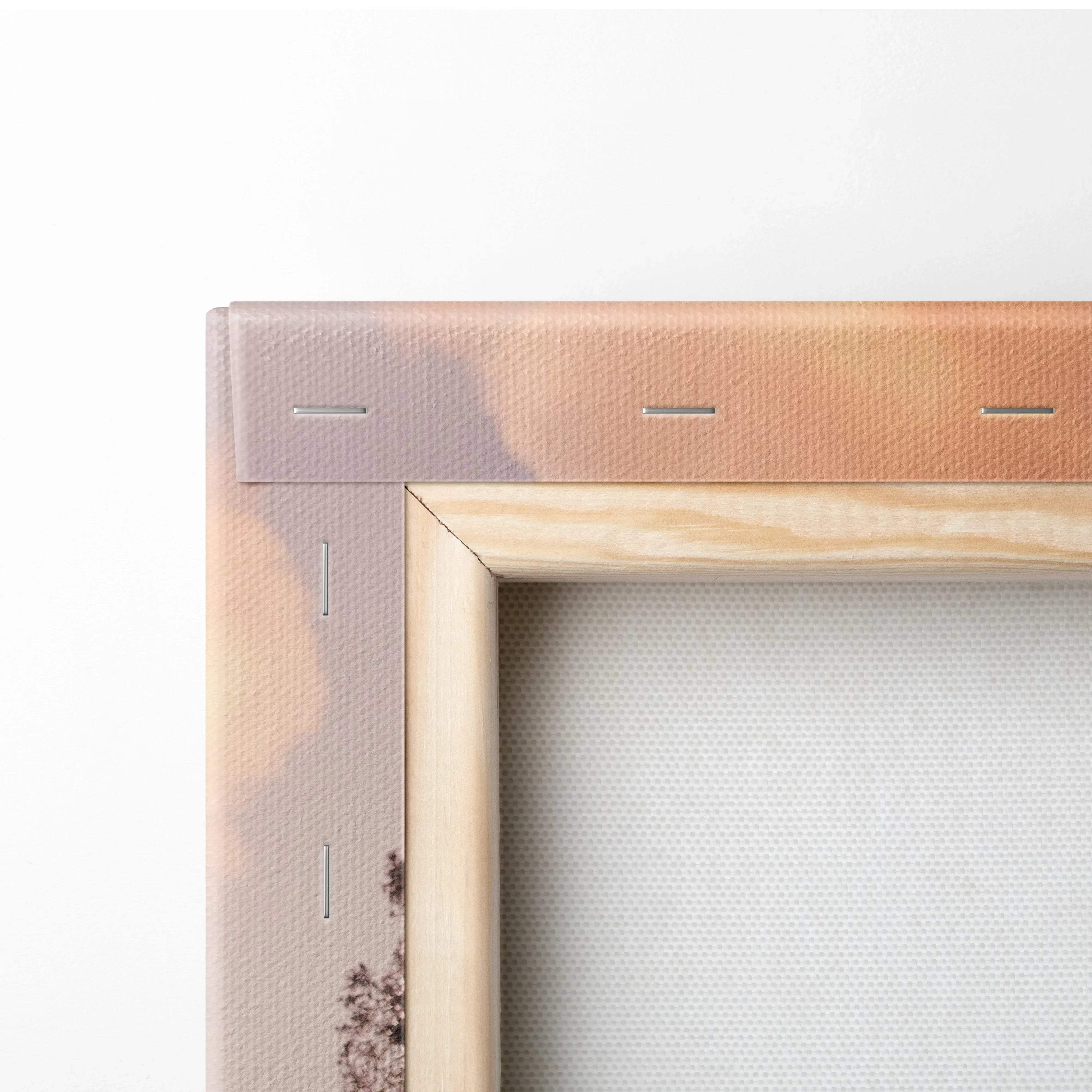 Close-up of wooden frame and canvas fabric with muted color print for canvas wall art.