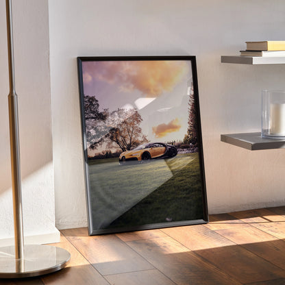 Bugatti Chiron Pur Sport hypercar poster with sunset sky, framed wall art leaning on floor.