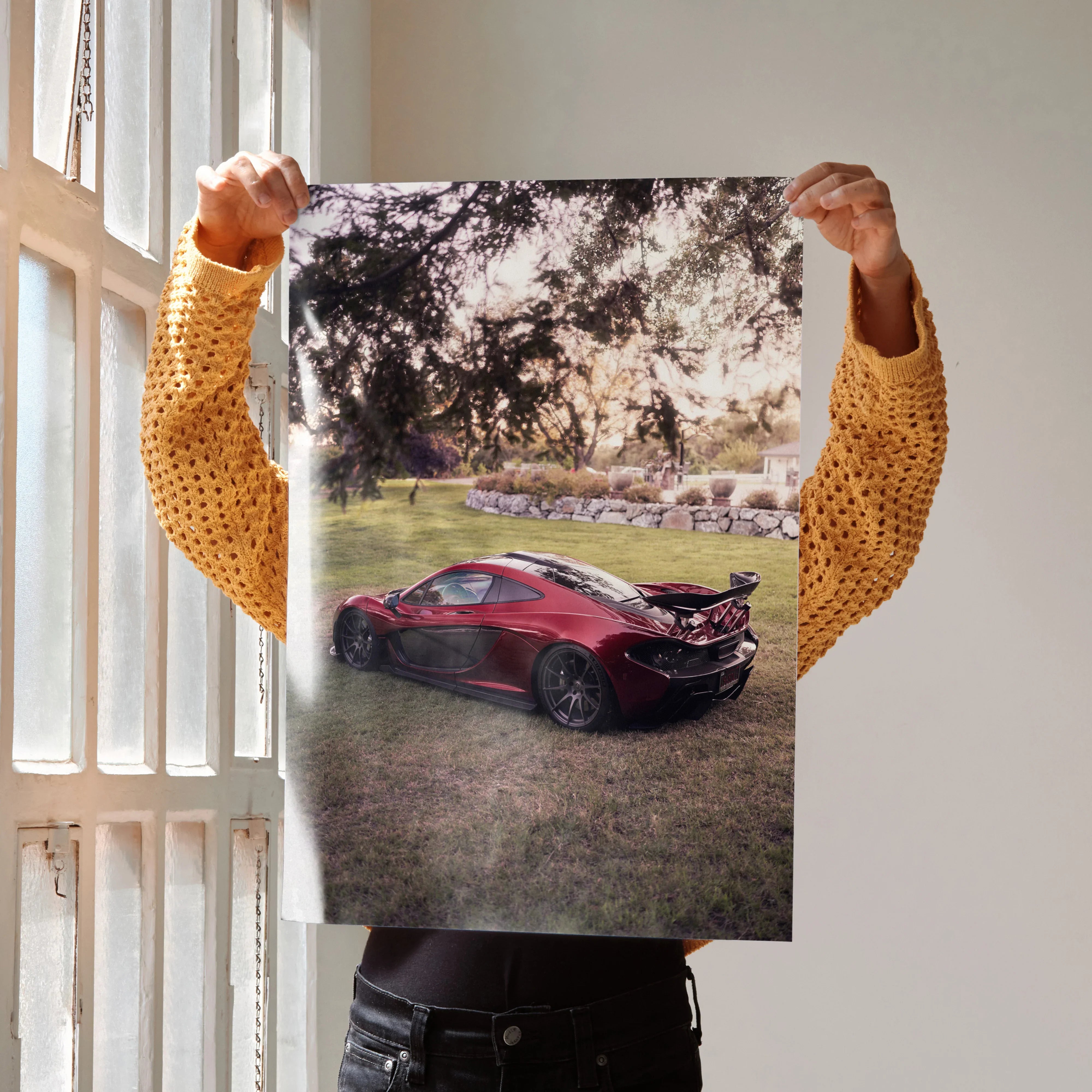Poster wall art featuring a red McLaren P1 parked on grass under a large tree with sunlight filtering through.