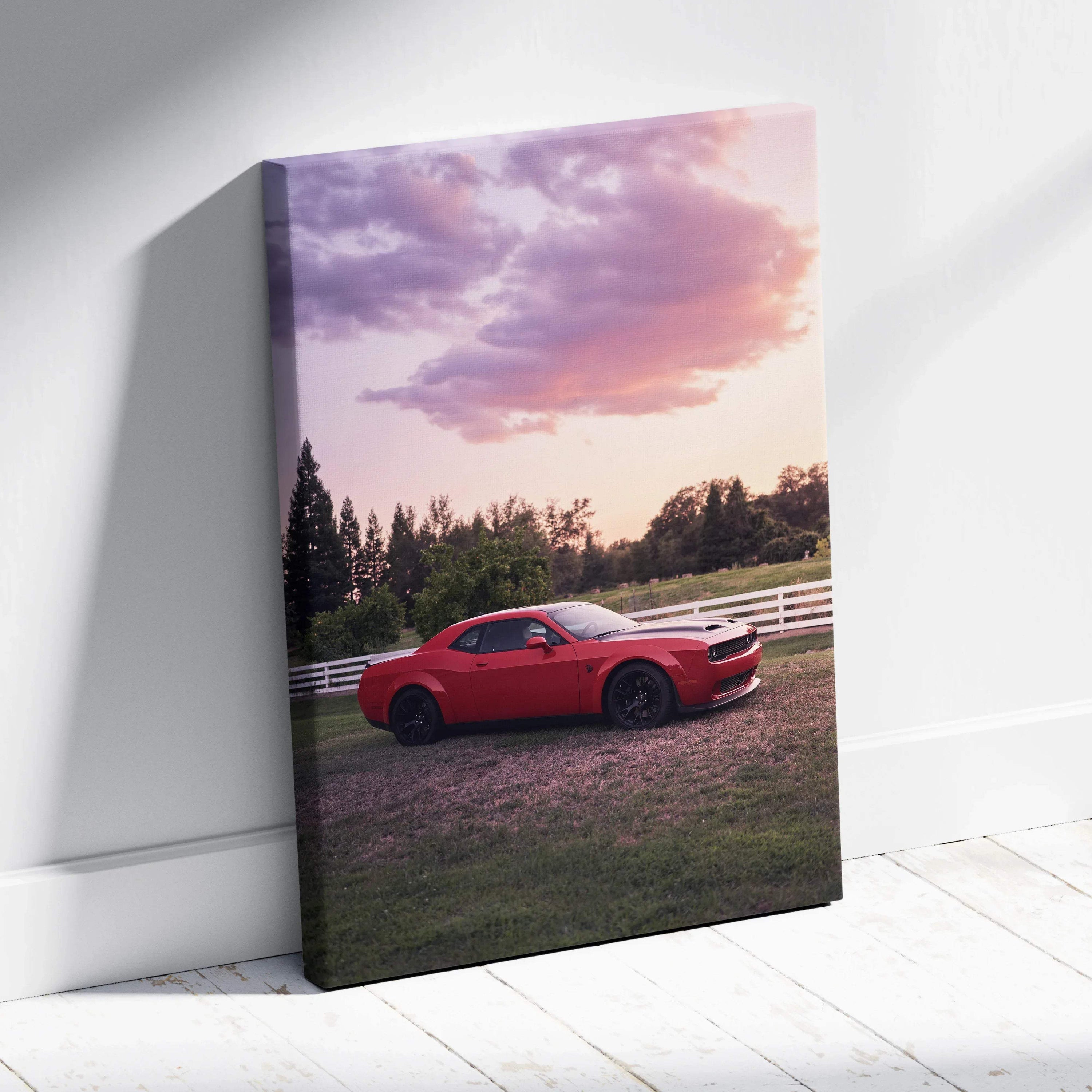 Red Dodge Challenger Hellcat parked on grass at sunset with vibrant sky, vertical canvas wall art.