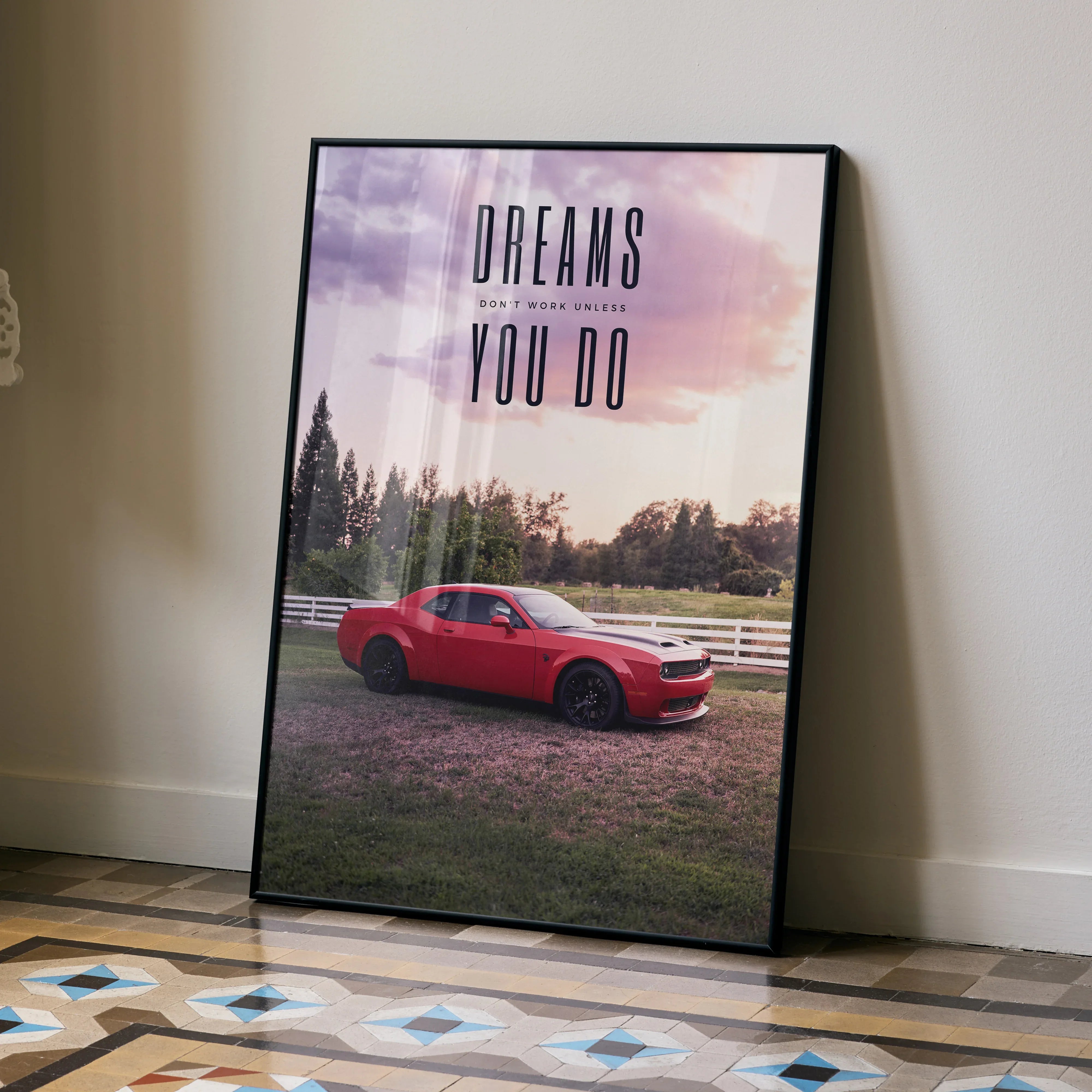 Motivational poster wall art featuring red Dodge Challenger Hellcat with inspirational text "Dreams don’t work unless you do".