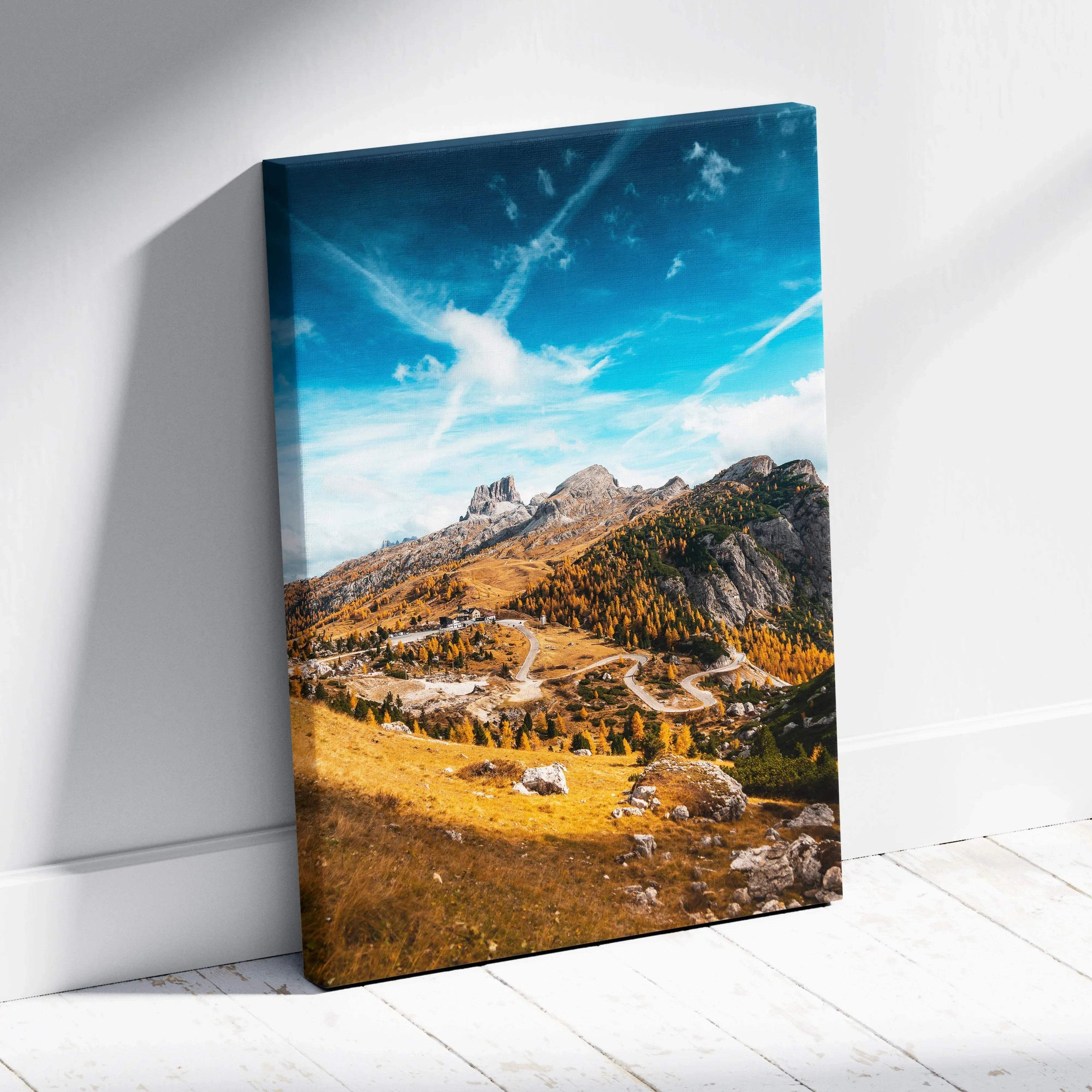 Vertical autumn mountain landscape with winding trail under vibrant blue sky on canvas wall art.
