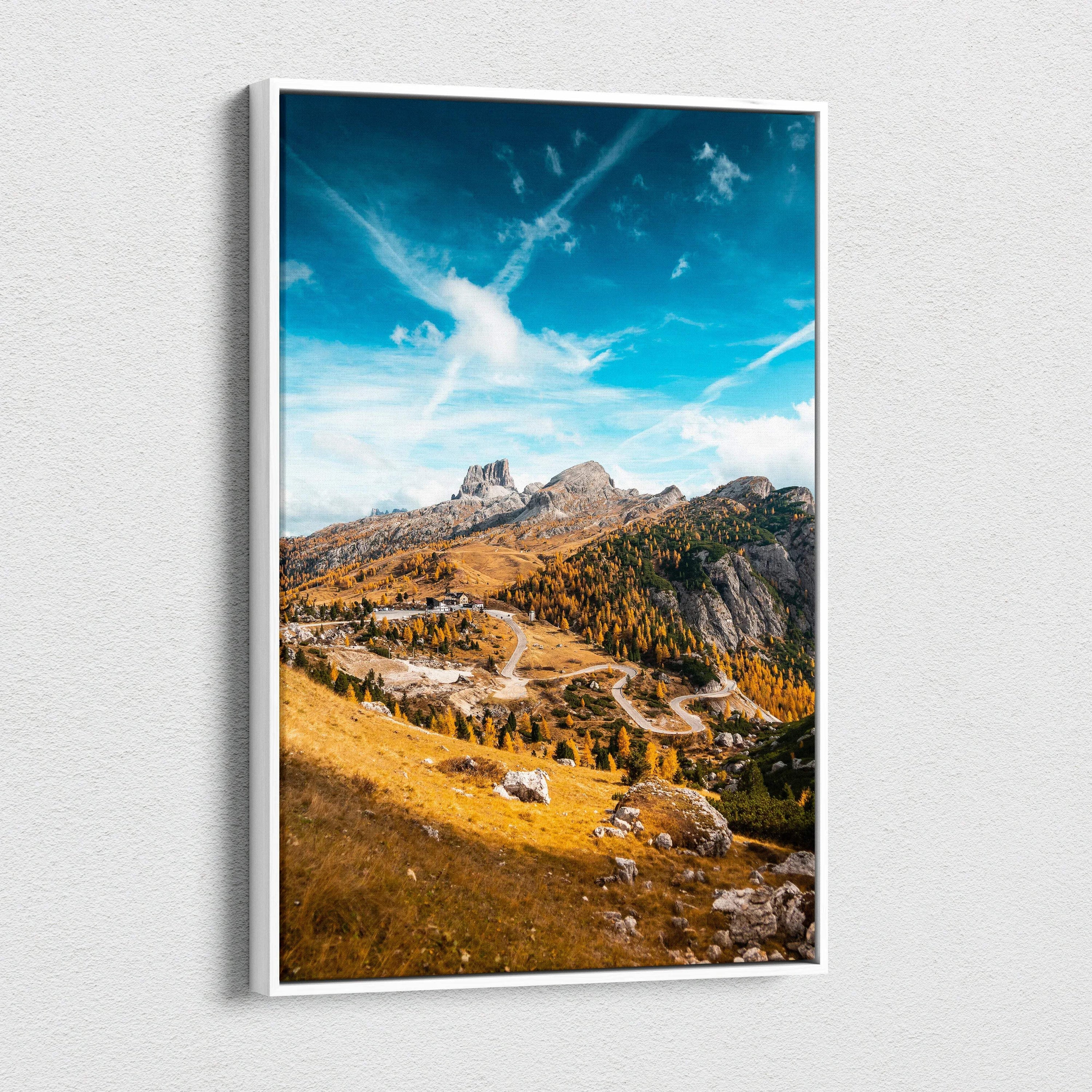 Vertical canvas art of autumn mountains with golden foliage and a dramatic blue sky wall art.