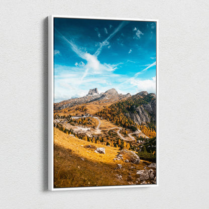 Vertical canvas art of autumn mountains with golden foliage and a dramatic blue sky wall art.