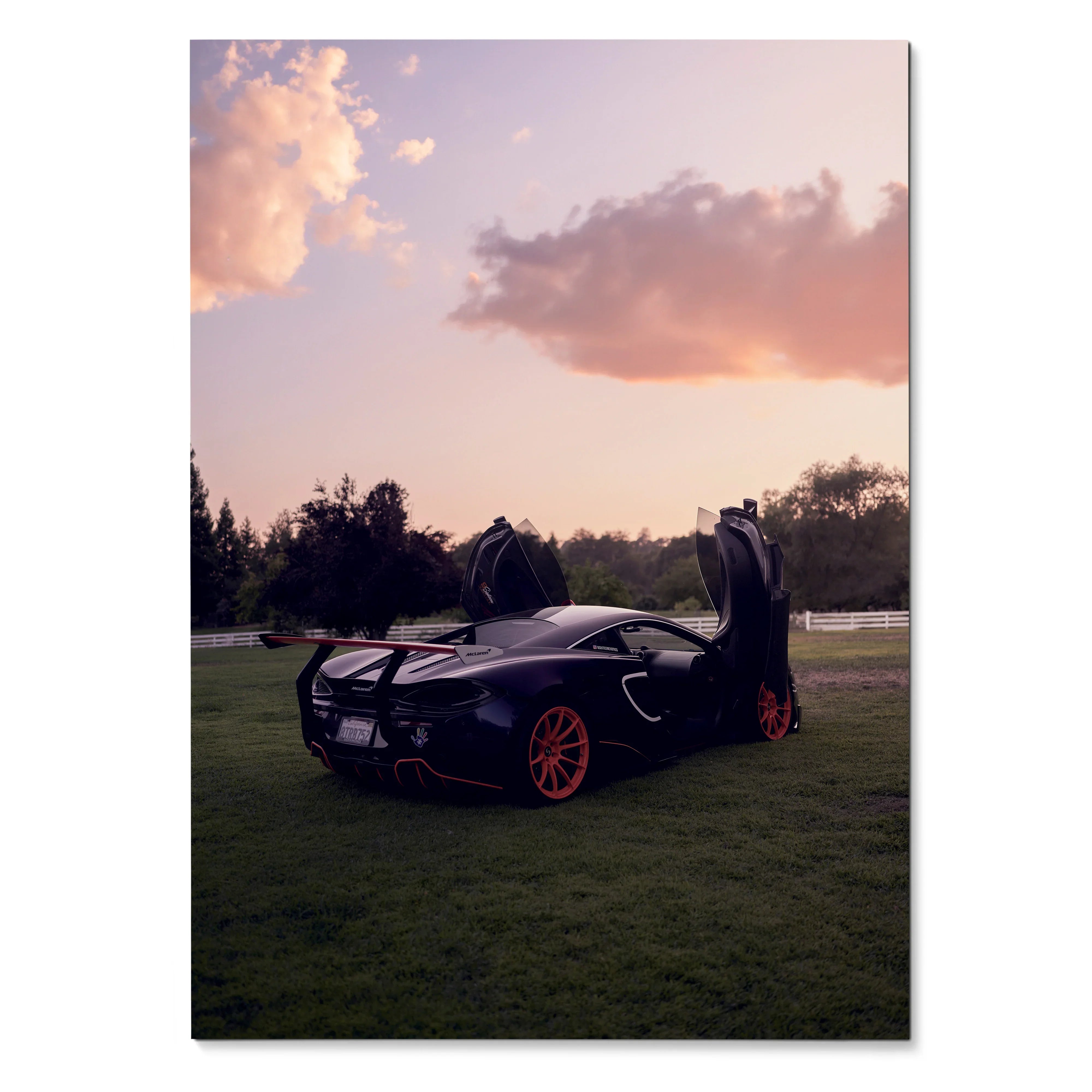 McLaren 570s supercar with butterfly doors open on grass at sunset poster wall art.