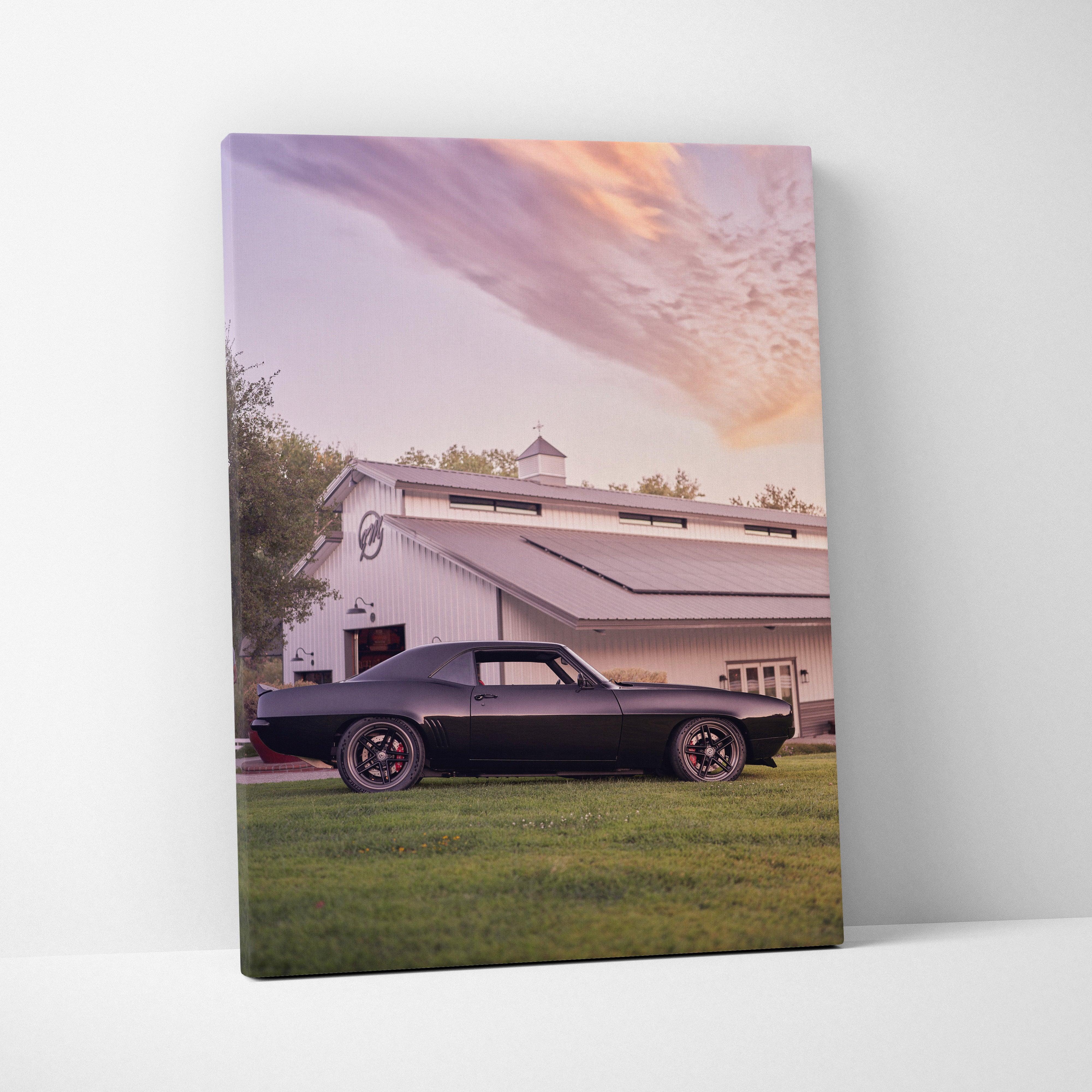 1969 Camaro classic car against a sunset sky on vertical canvas wall art.