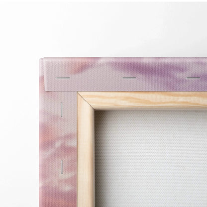 Close-up of wooden frame and stapled stretched canvas with soft purple and pink tones, museum-quality canvas art wall decor.