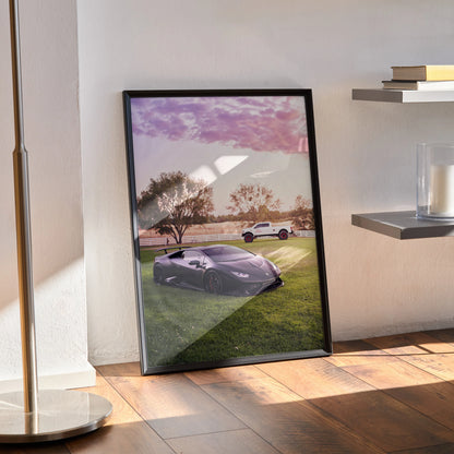 Lamborghini Huracan poster wall art with sunset sky and grassy field in black frame.