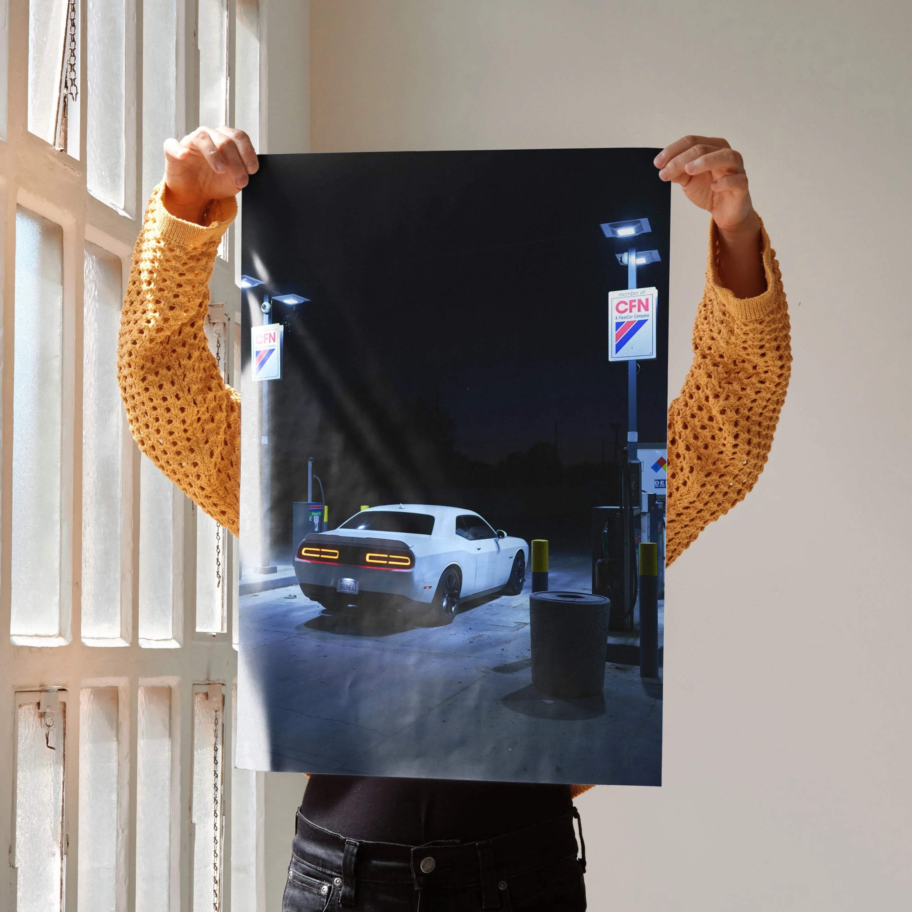 Dodge Challenger poster featuring rear view of white muscle car at gas station at night, wall art print.