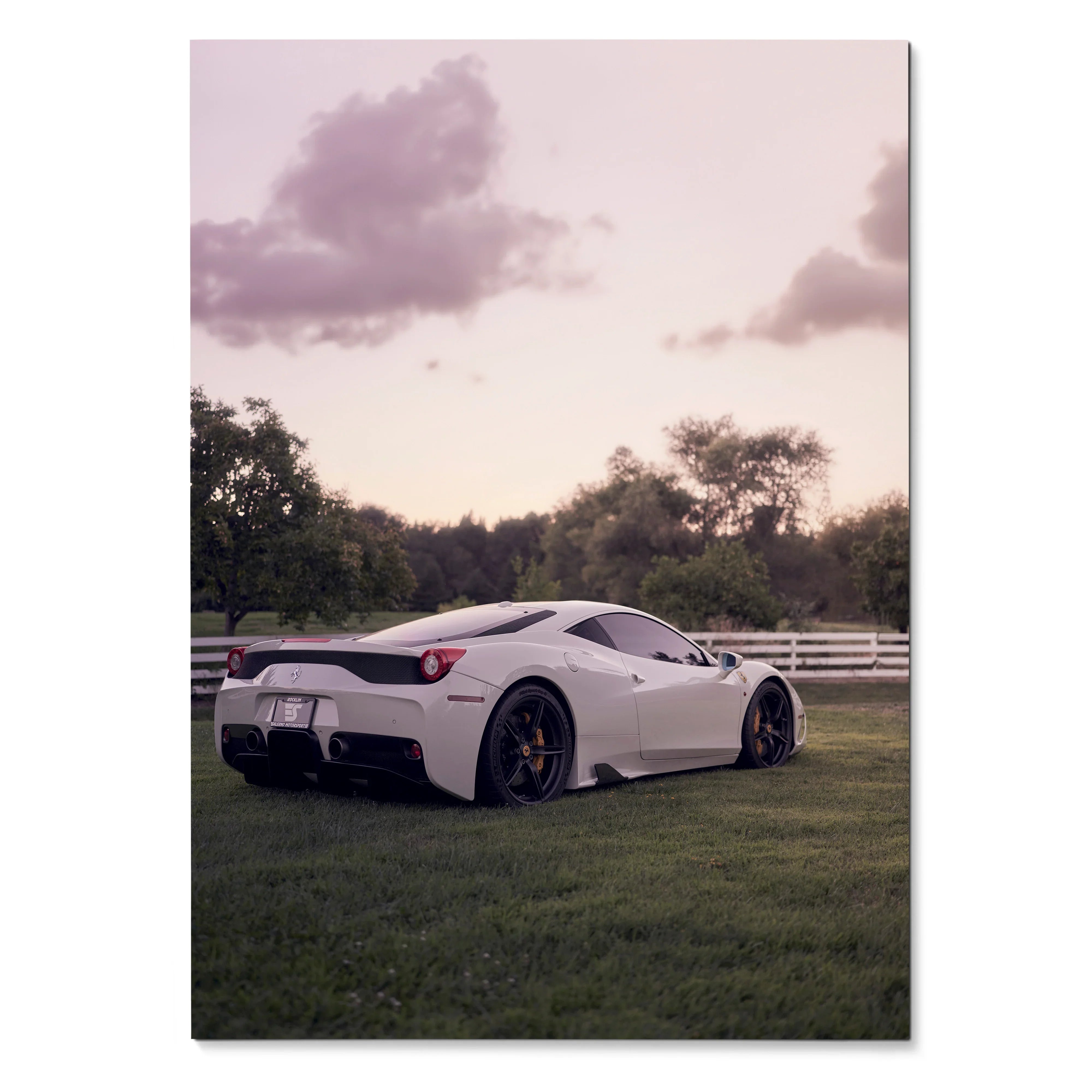 White Ferrari 458 Italia supercar parked on grass with soft sunset sky poster wall art.