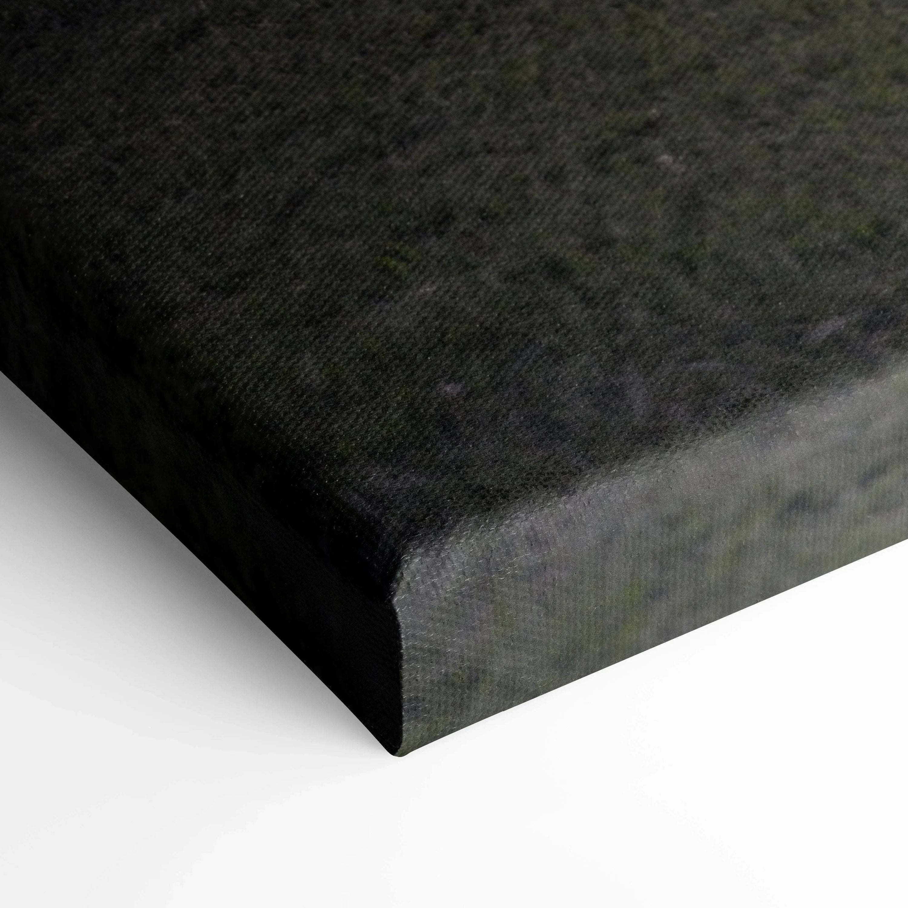 Close-up of dark canvas texture and wrapped edge of vertical wall art print.