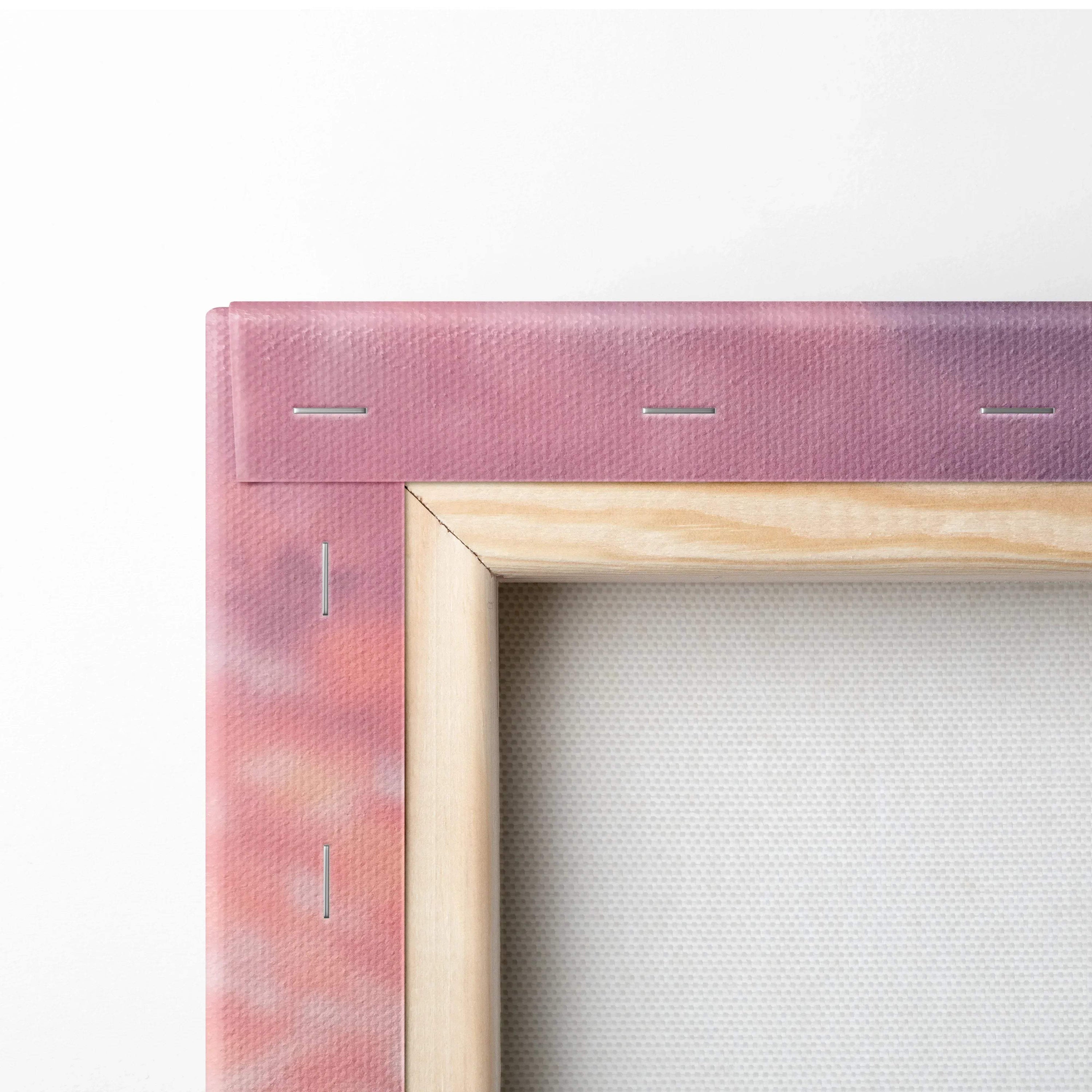 Close-up of stretched canvas with wooden frame and sunset-colored fabric, wall art detail.