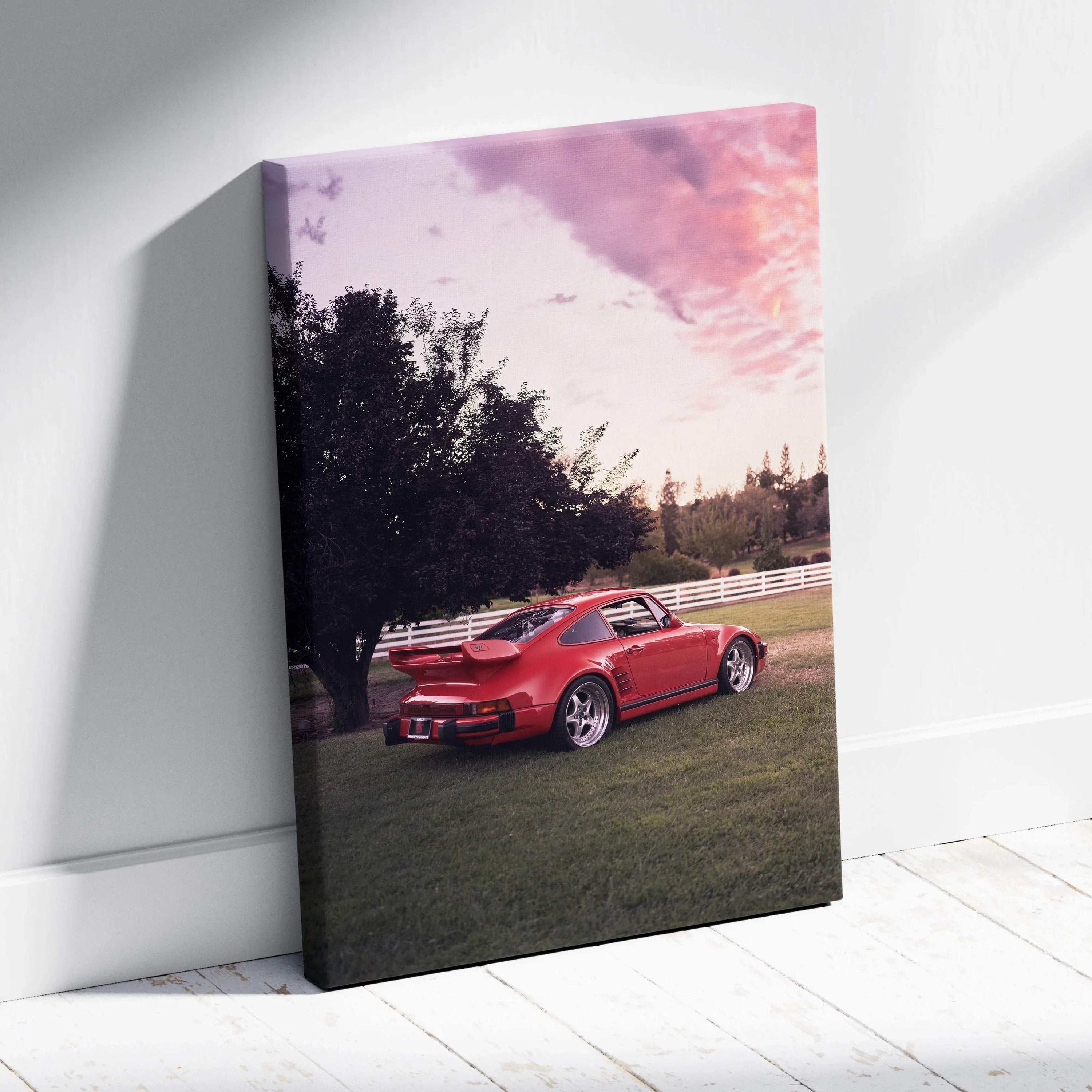 Red Porsche 911 Turbo Slant-Nose parked on grass at sunset canvas wall art.