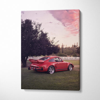 Red Porsche 911 Turbo Slant-Nose parked on grass with sunset sky canvas wall art.