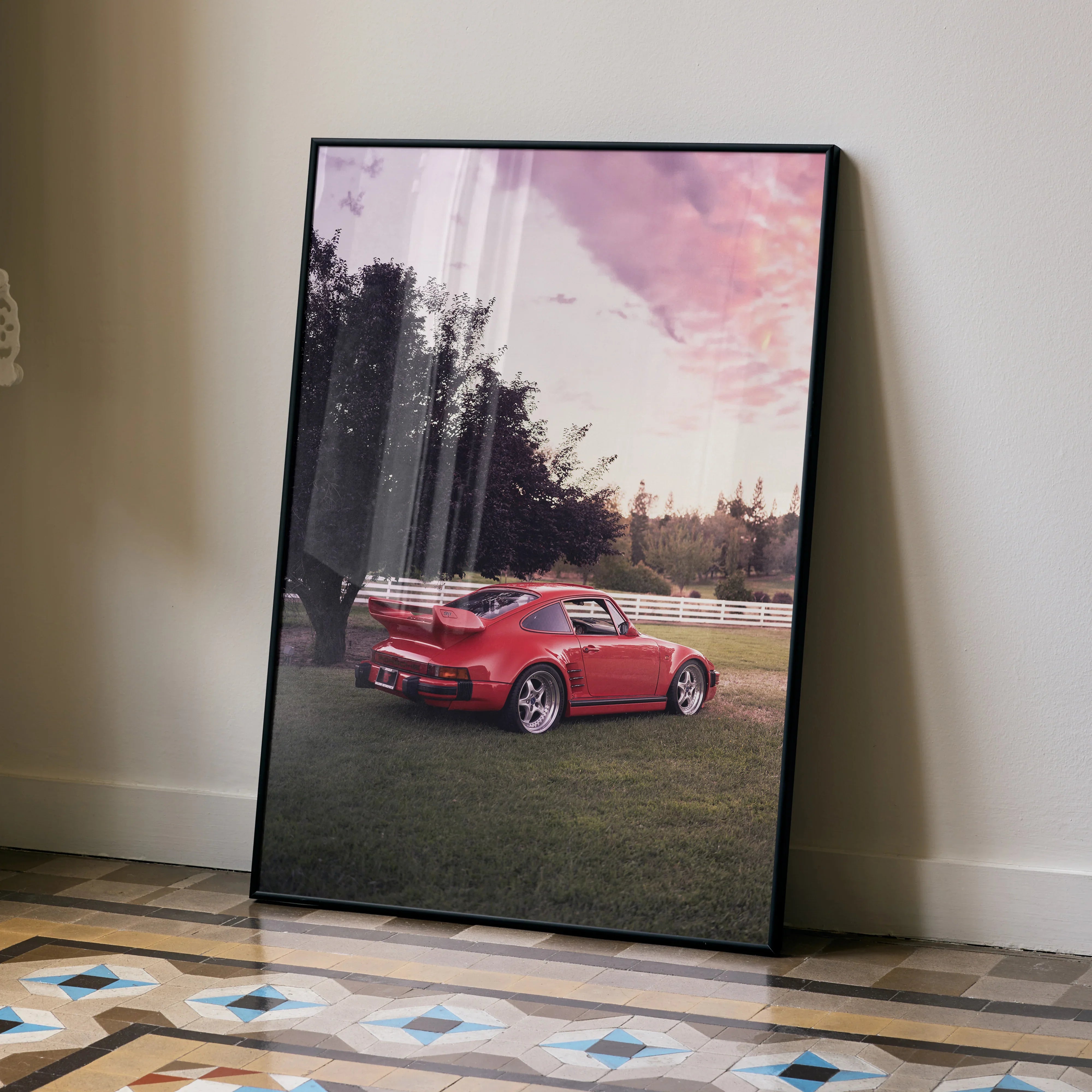 Red Porsche 911 Turbo Slant-Nose poster wall art with sunset sky in black frame.