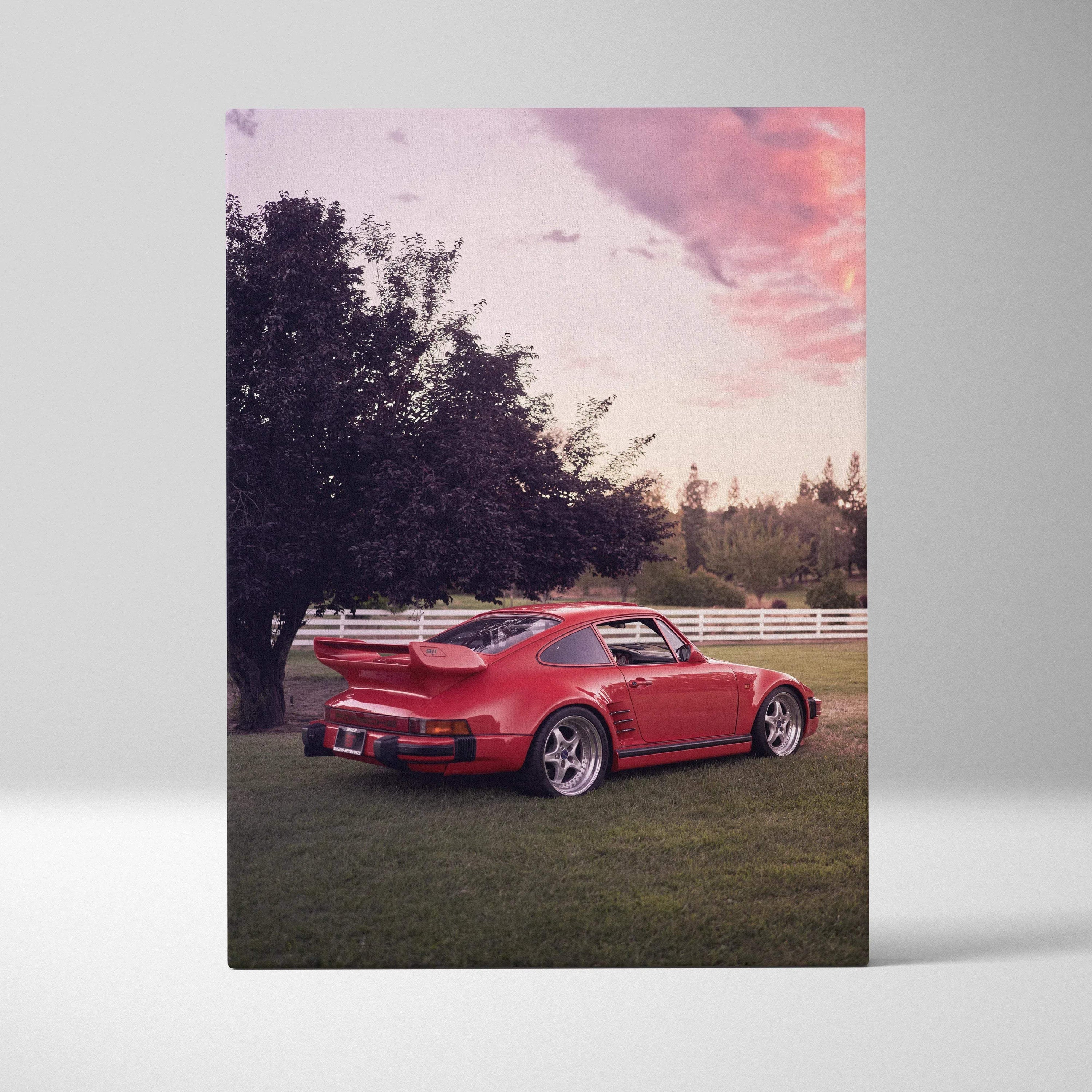 Red Porsche 911 Turbo Slant-Nose canvas wall art with sunset and tree background, vertical format.