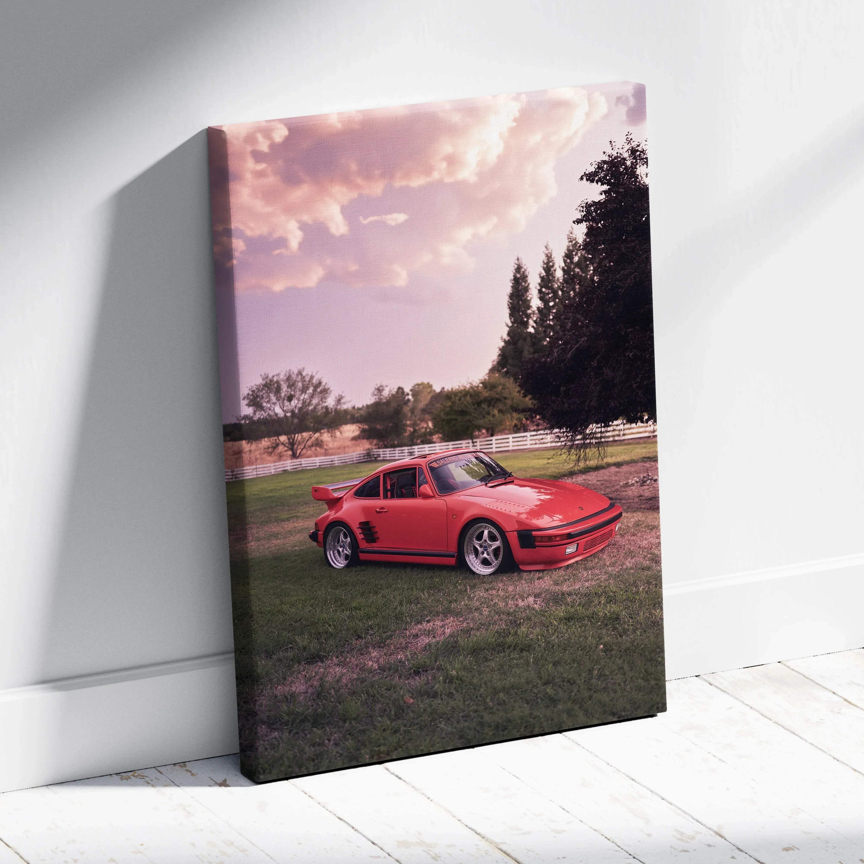 Red Porsche 911 Turbo Slant-Nose parked on grass at sunset on vertical canvas wall art.