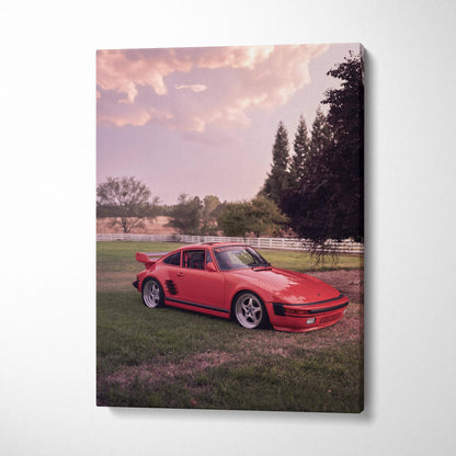 Red Porsche 911 Turbo Slant-Nose parked on grass at sunset, vertical canvas wall art.