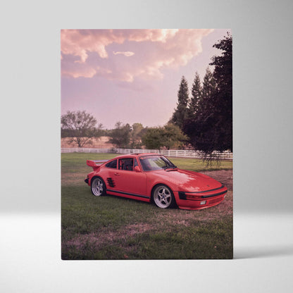 Red Porsche 911 Turbo Slant-Nose on grass with sunset sky, printed on vertical canvas wall art.
