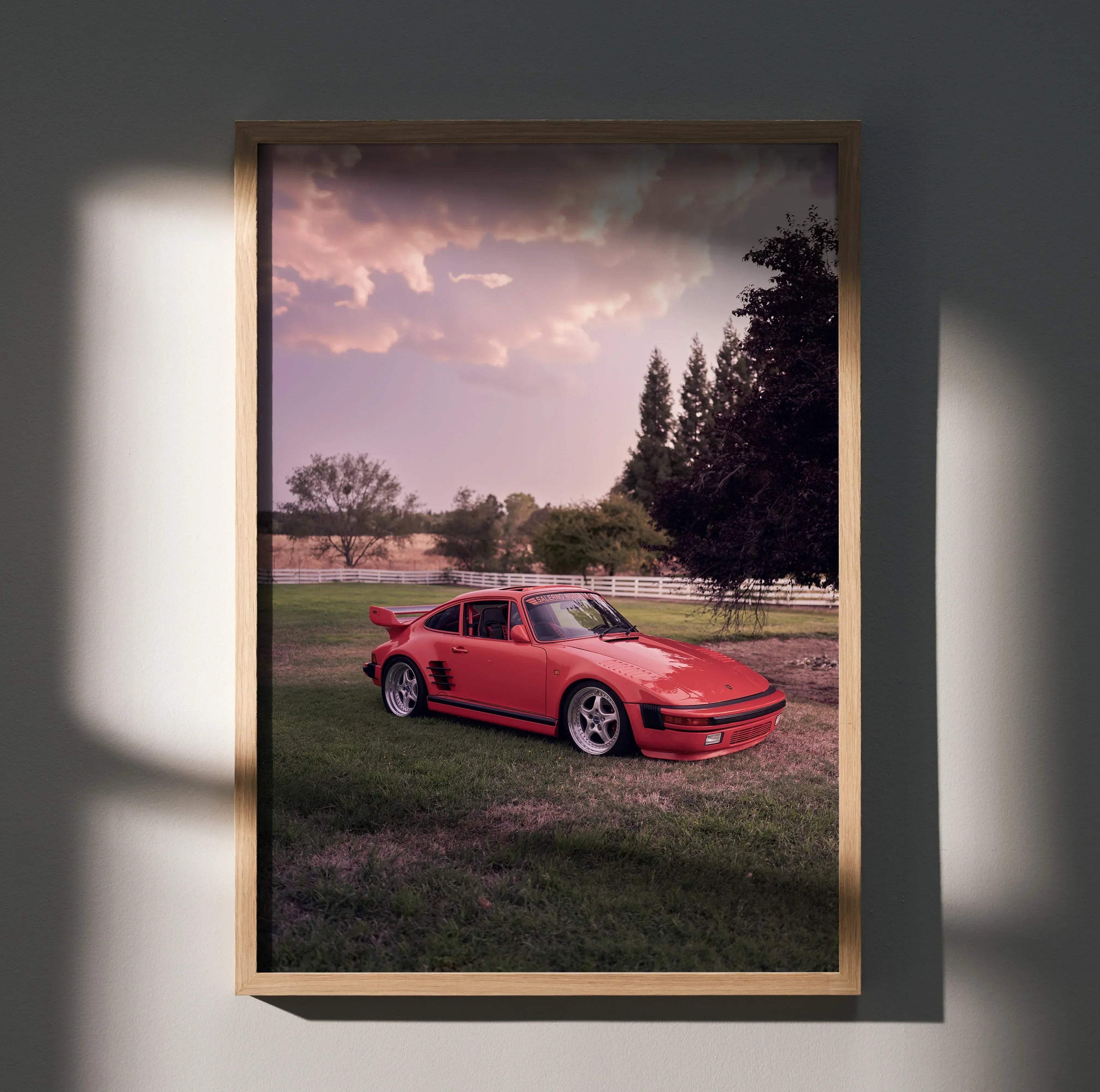 Porsche 911 Turbo Slant-Nose poster with red car on grass at sunset, framed wall art.