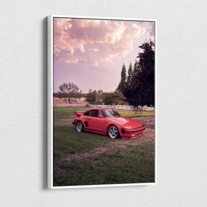 Red Porsche 911 Turbo Slant-Nose on grass at sunset canvas wall art in vertical format.