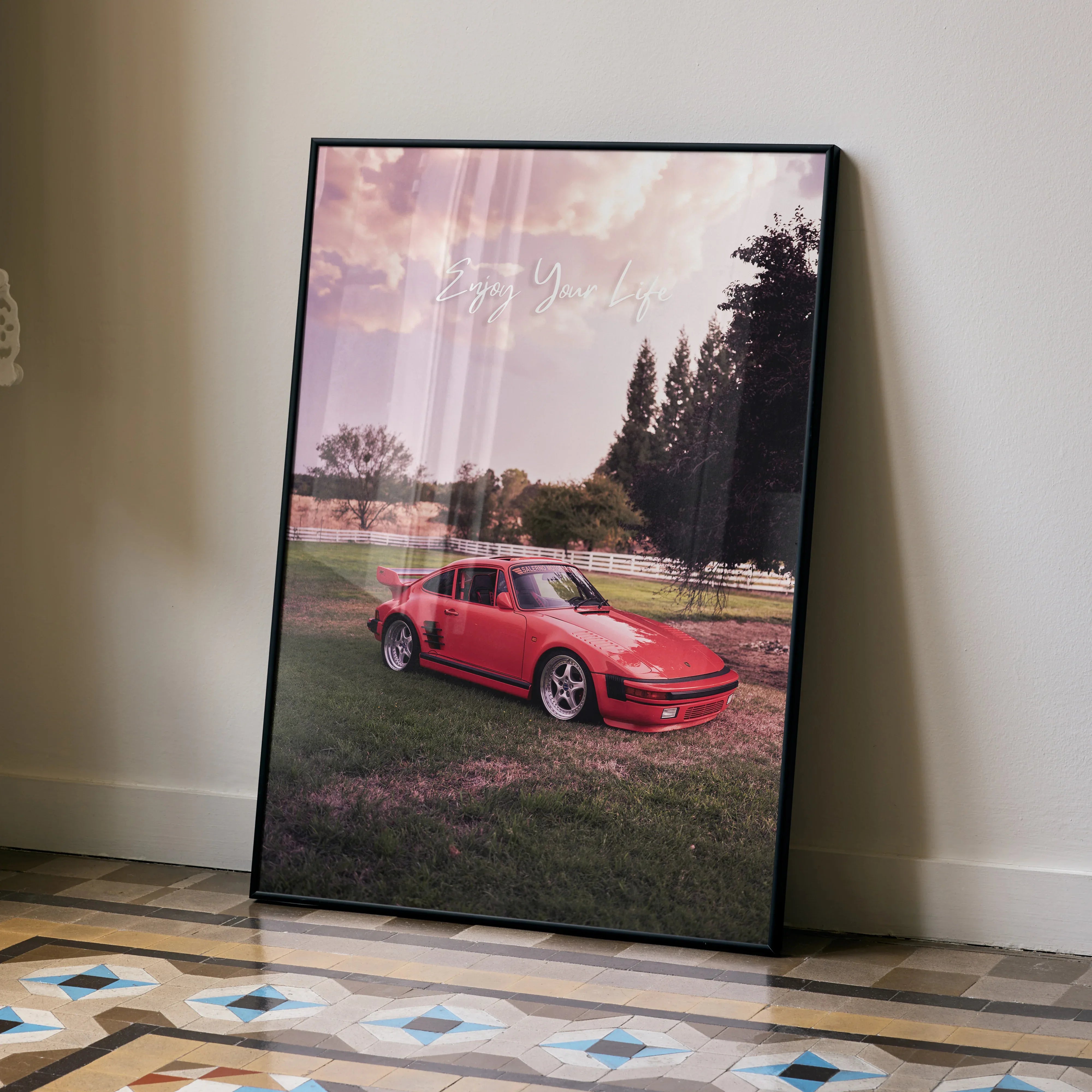 Poster of red Porsche 911 Turbo Slant-Nose on grass under soft pink skywall art.