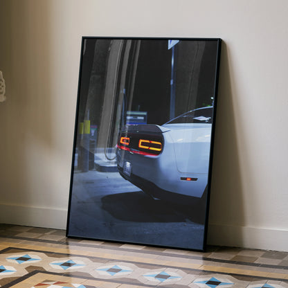 Dodge Challenger rear view in dark urban setting premium wall art poster in black frame.