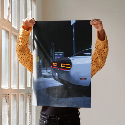 Dodge Challenger rear view illuminated taillights nighttime poster wall art.