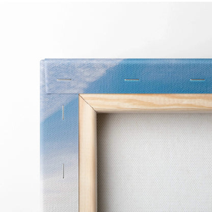 Close-up of wooden frame and stapled canvas back showing blue sky detail in wall art canvas print.