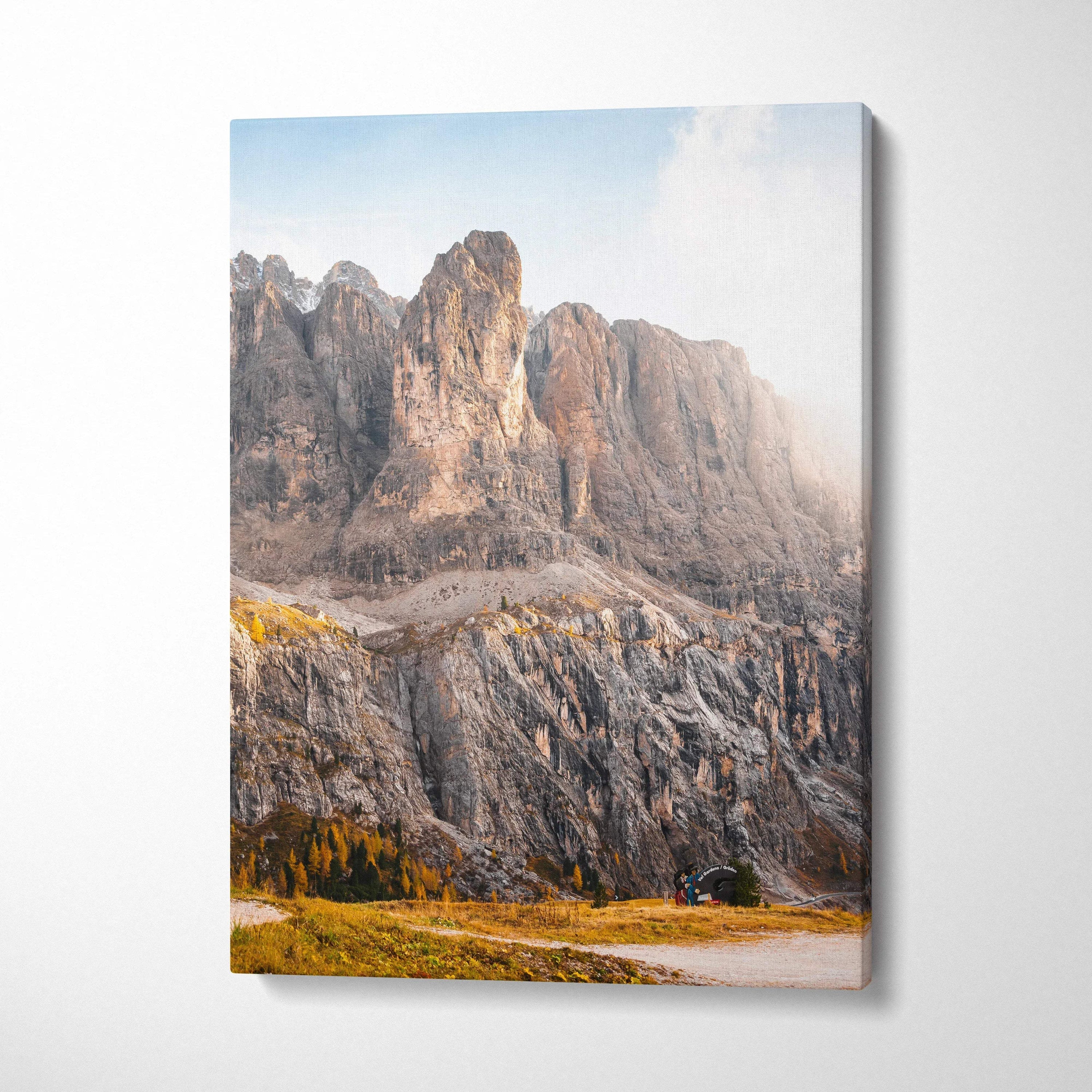 Vertical canvas wall art featuring rugged autumn mountains with rocky cliffs and golden foliage.