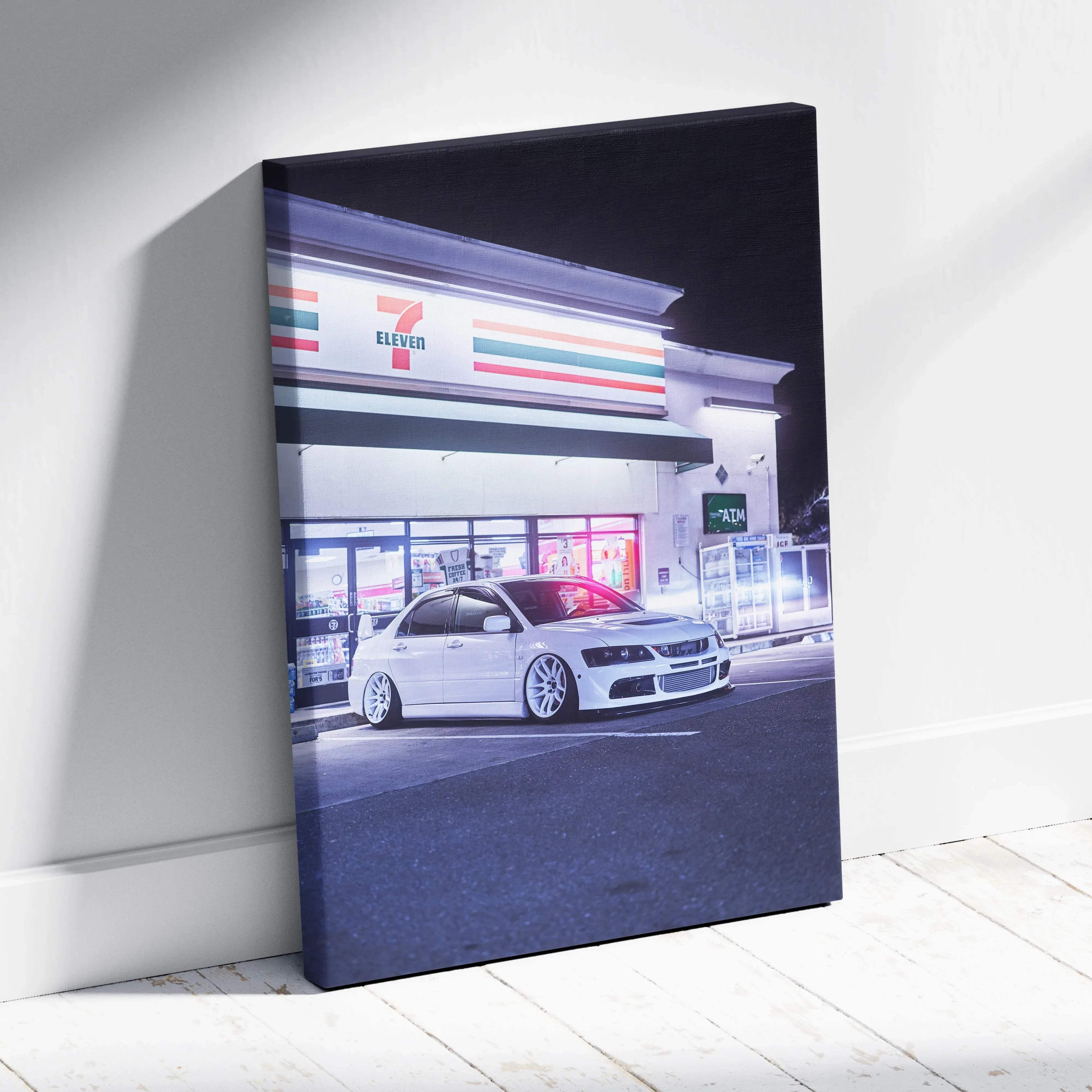 Canvas wall art of white mitsubishi lancer evolution parked at night with neon lights outside 7-eleven store