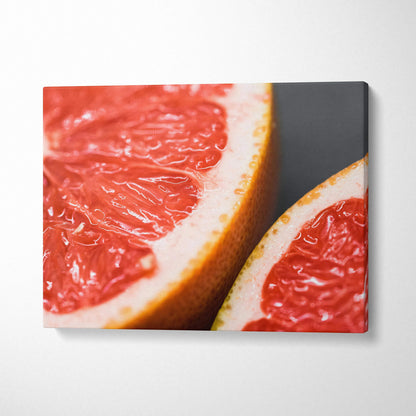 Vibrant grapefruit close-up on canvas wall art with bright red and orange colors for modern decor.