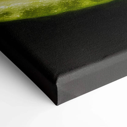 Close-up of black gallery-wrapped canvas edge with vibrant lime detail, modern wall art decor.