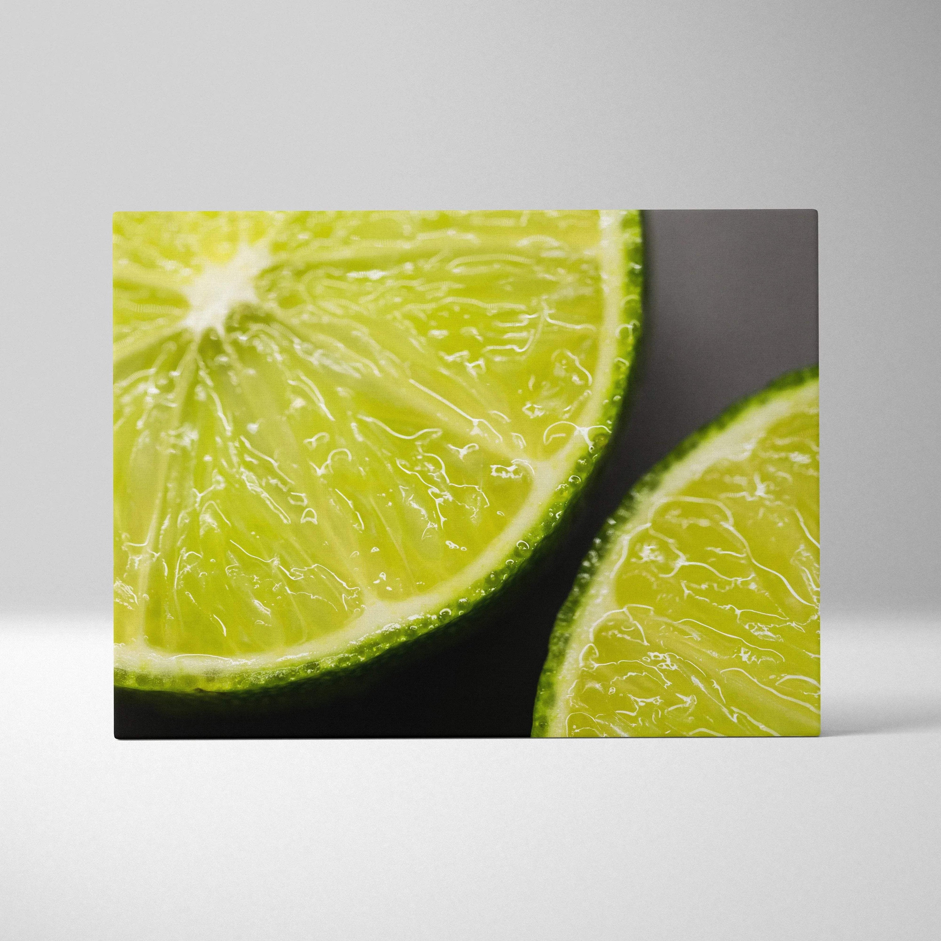 High-resolution canvas wall art featuring close-up of juicy green lime slices with vibrant, glossy texture on dark.