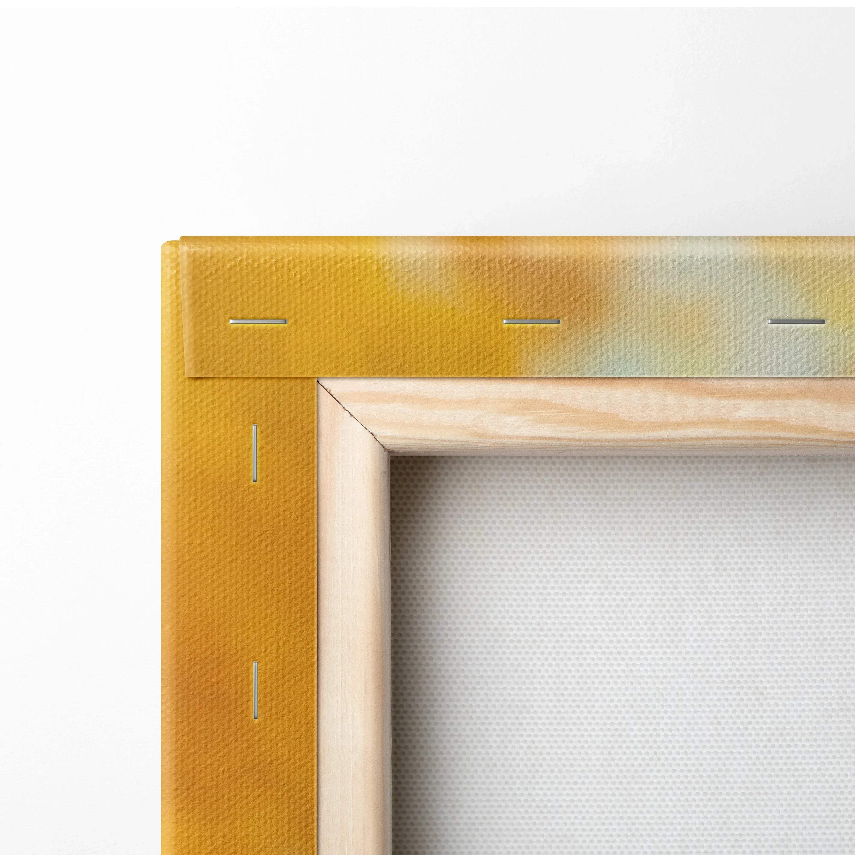 Corner close-up of stretched canvas wall art with wooden frame and vibrant yellow-orange edges.